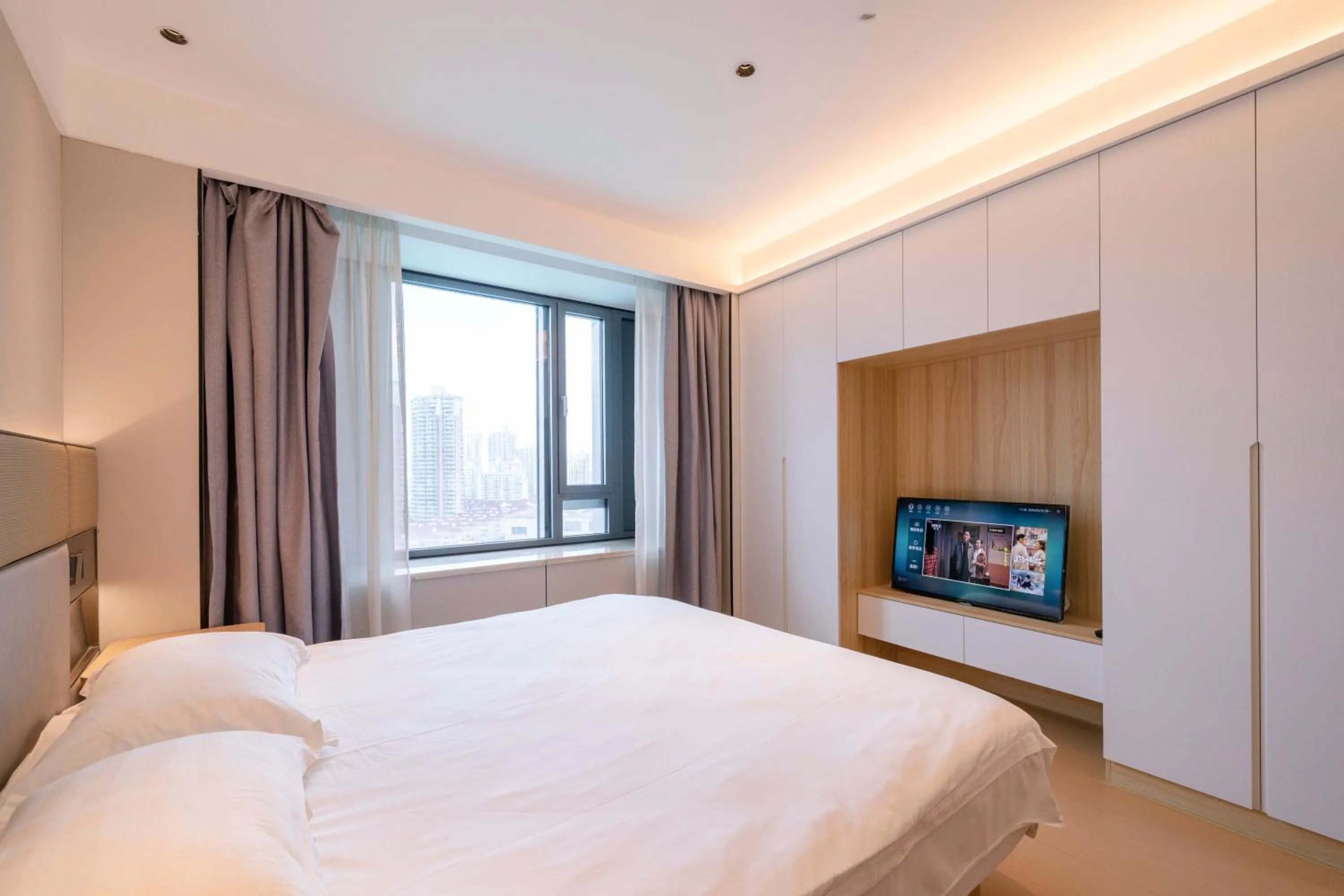 Bed in Shanghai Jiarong Hotel Apartment