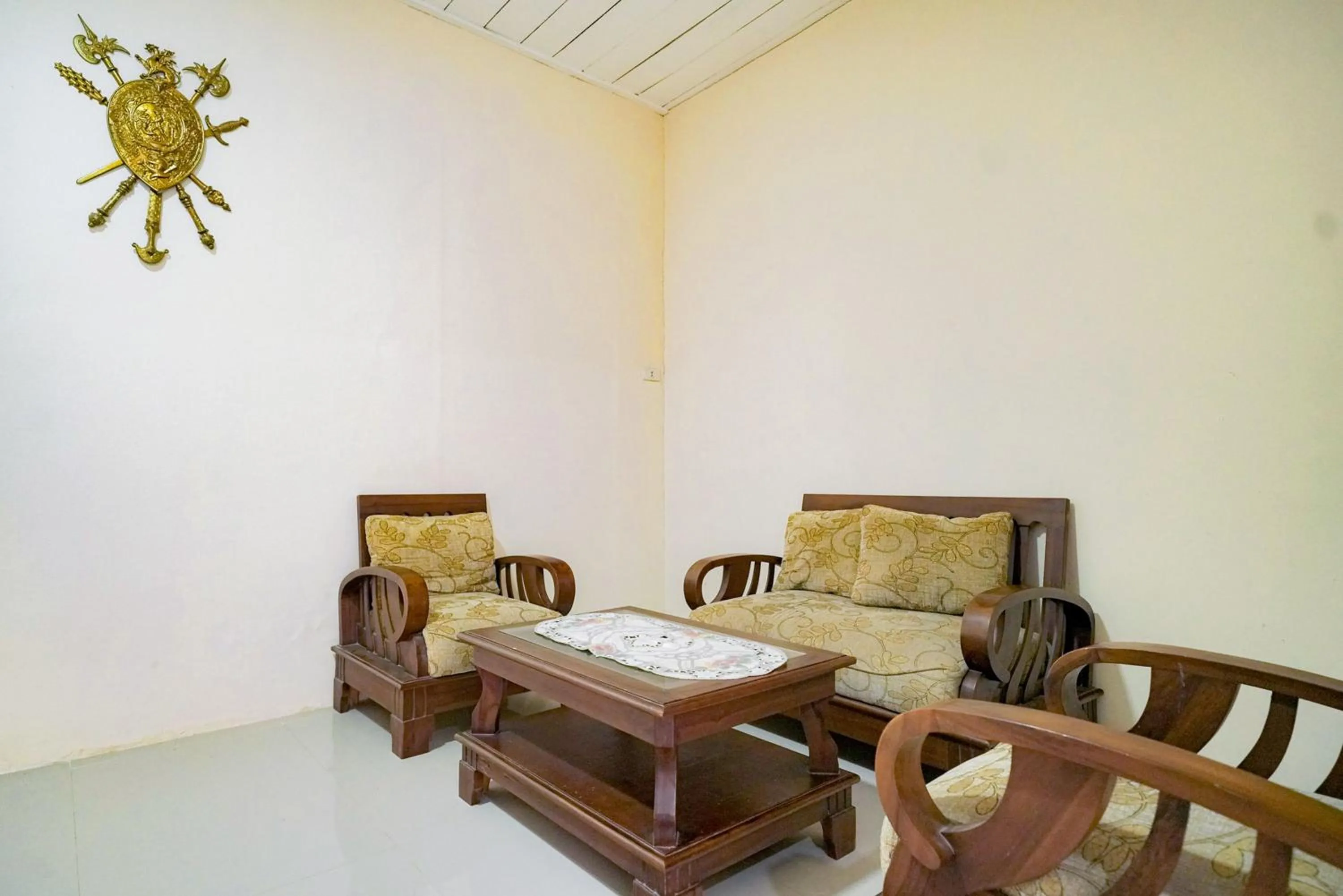 Seating area in Urbanview Hotel St Faustina Lampung by RedDoorz