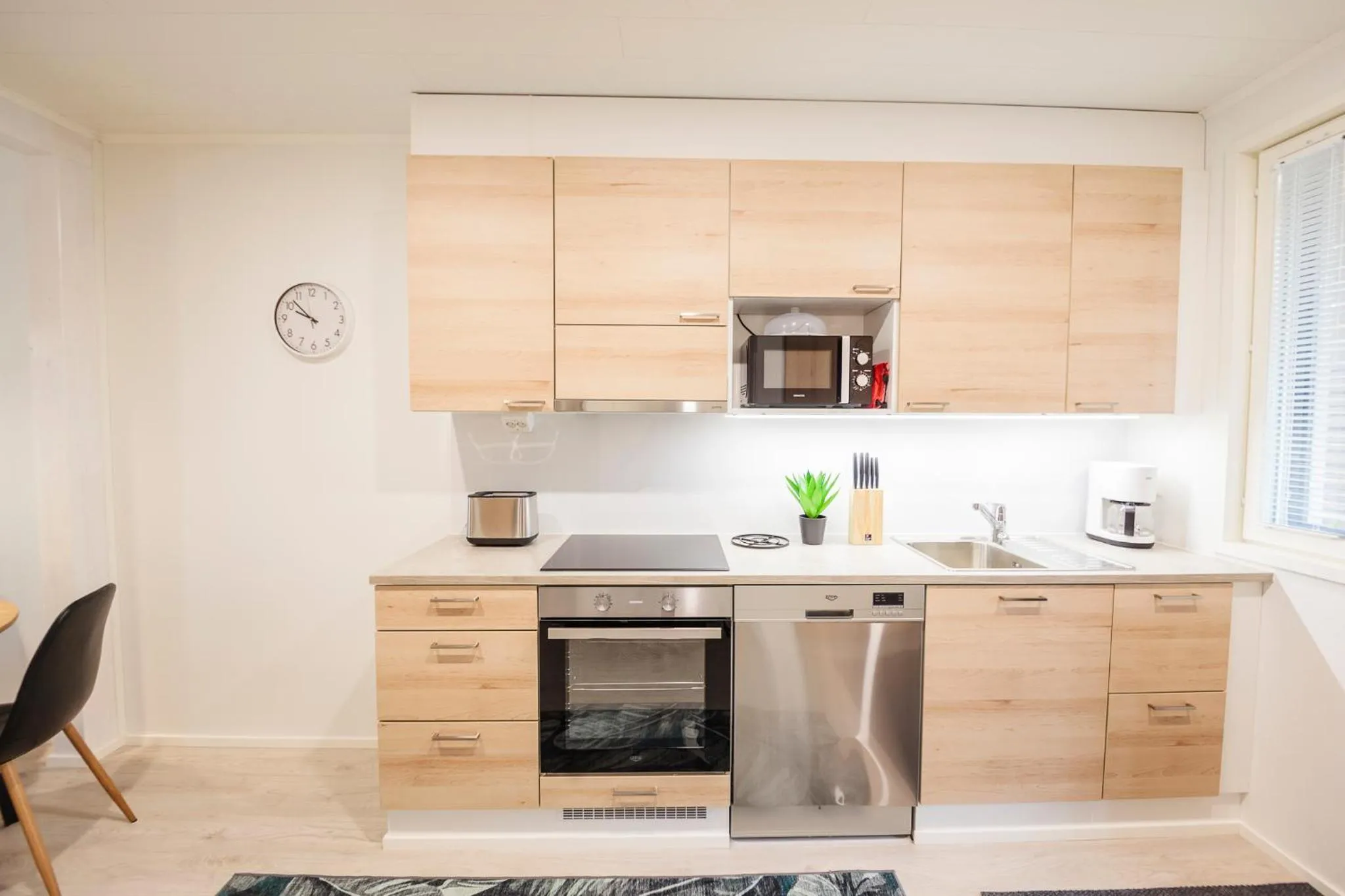 Kitchen or kitchenette in Tuomenkartano Apartments by Hiekka Booking