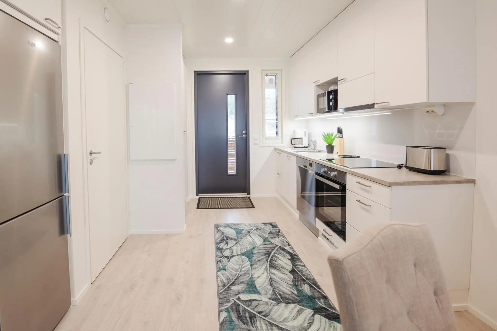 Kitchen or kitchenette in Tuomenkartano Apartments by Hiekka Booking