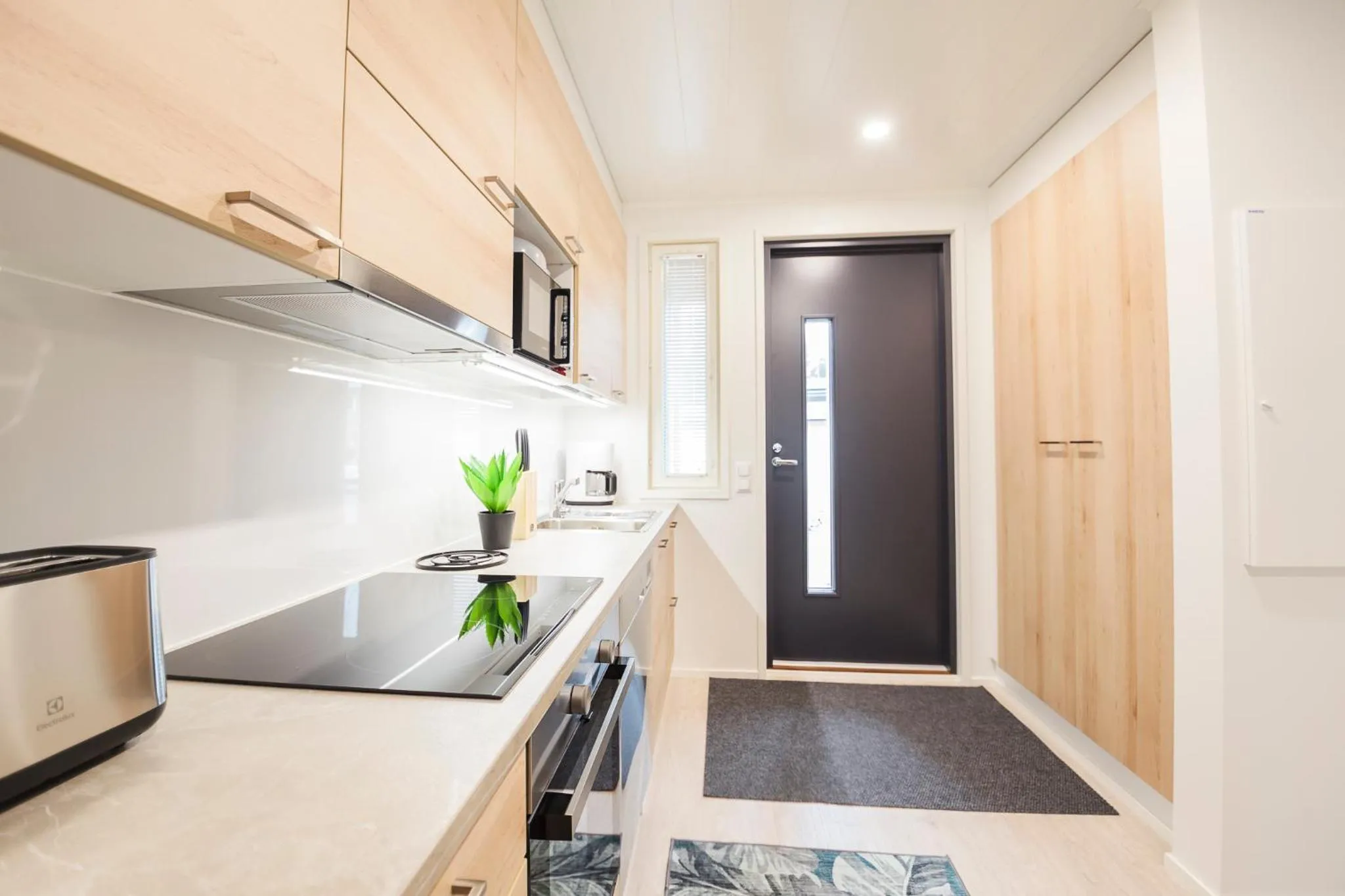 Kitchen or kitchenette in Tuomenkartano Apartments by Hiekka Booking