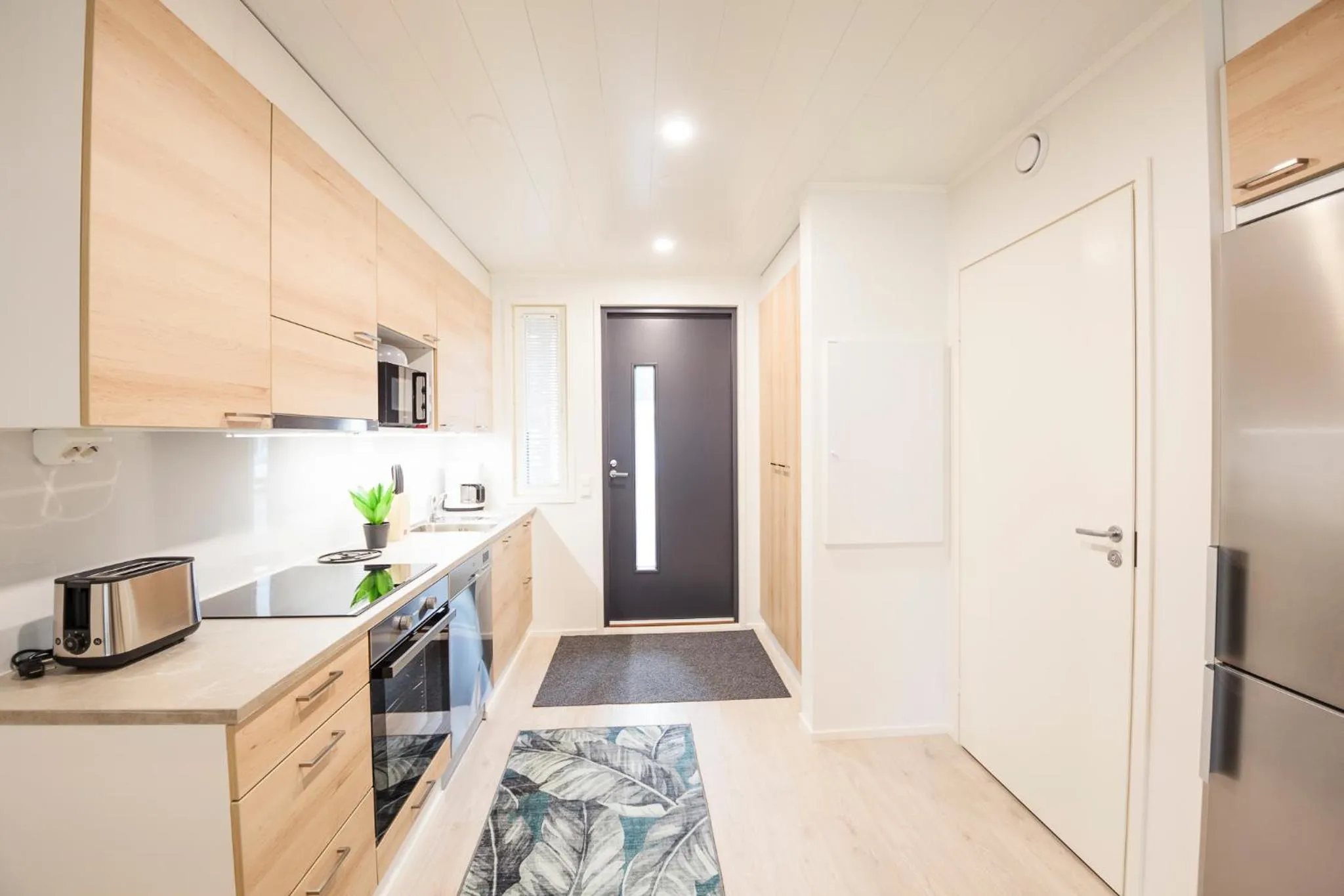Kitchen or kitchenette in Tuomenkartano Apartments by Hiekka Booking