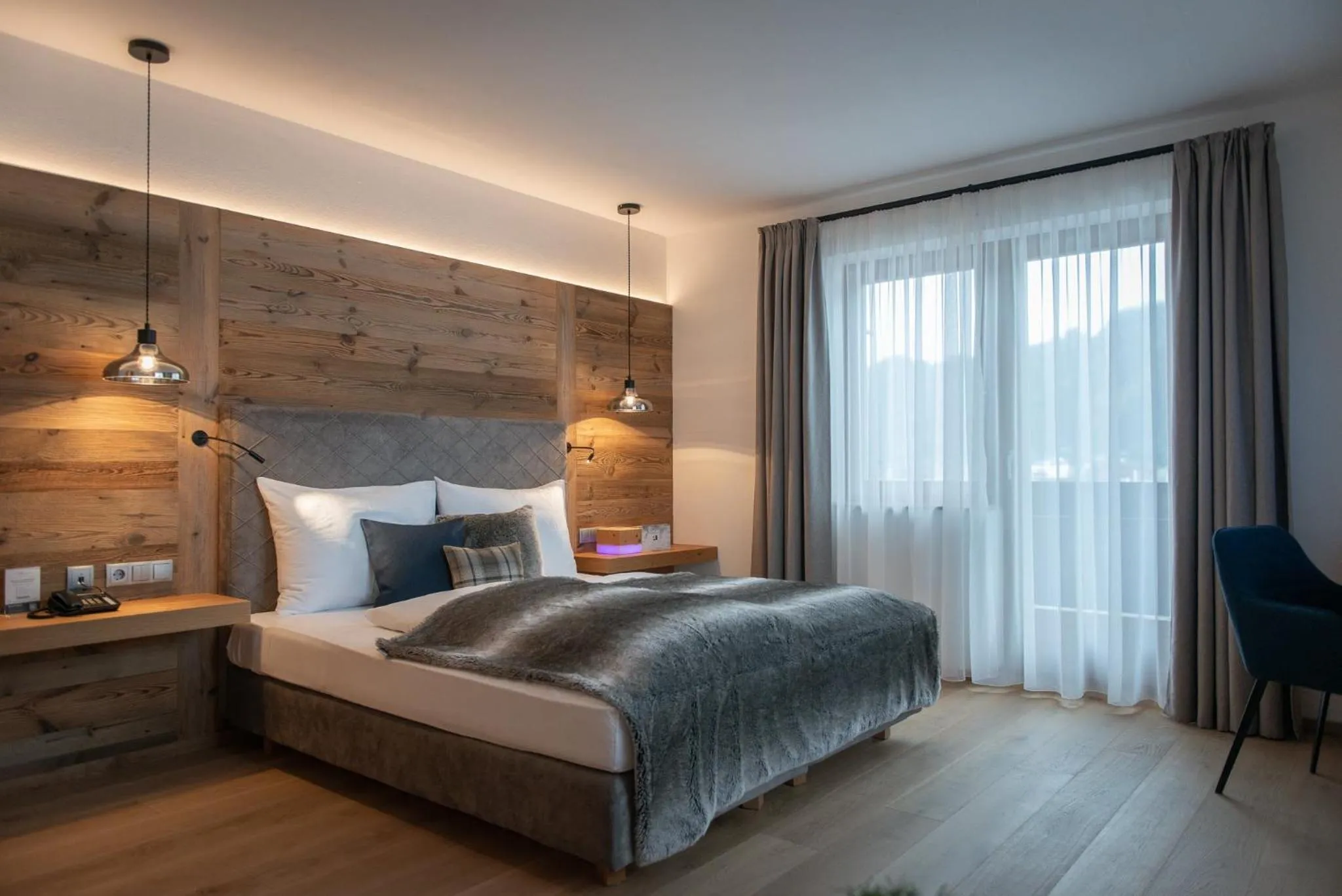 Garden view, Bed in Alpines Gourmet Hotel Montanara