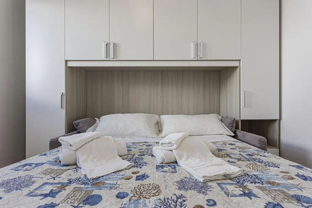 Bed in Stella del mare Apartments