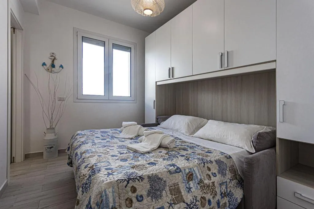 Bed in Stella del mare Apartments