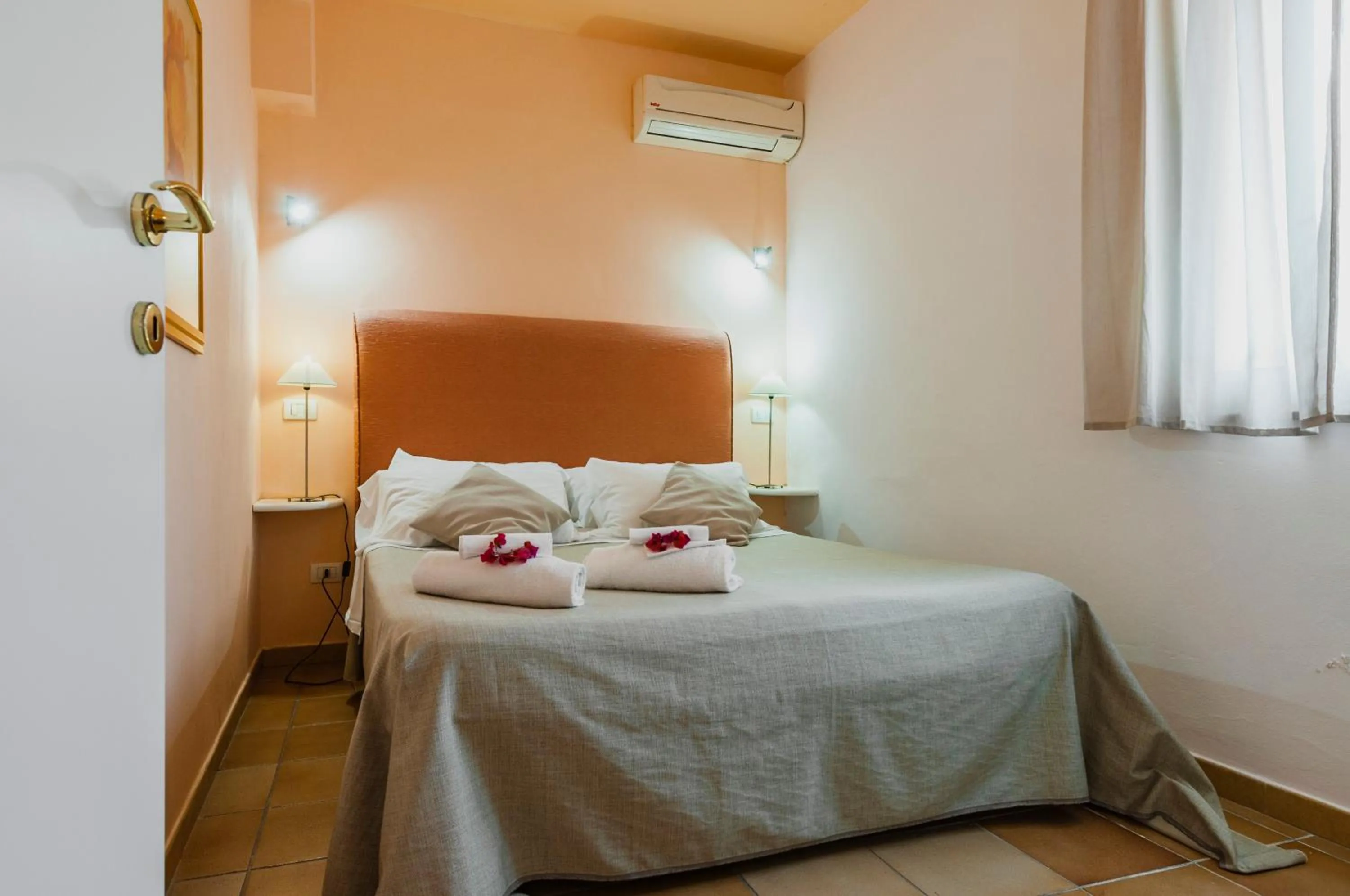 Bed in Stella del mare Apartments