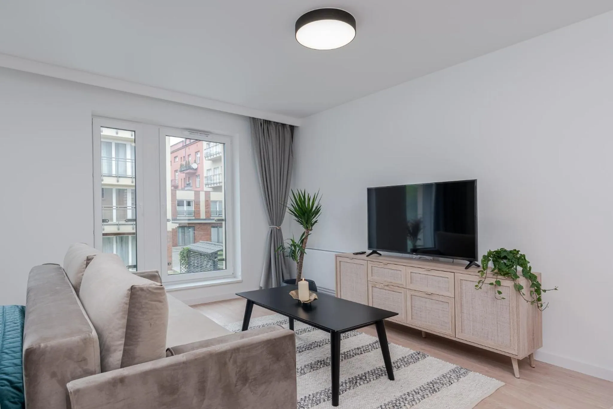 Living room in EXCLUSIVE Aparthotel Kraków Lubicz 40