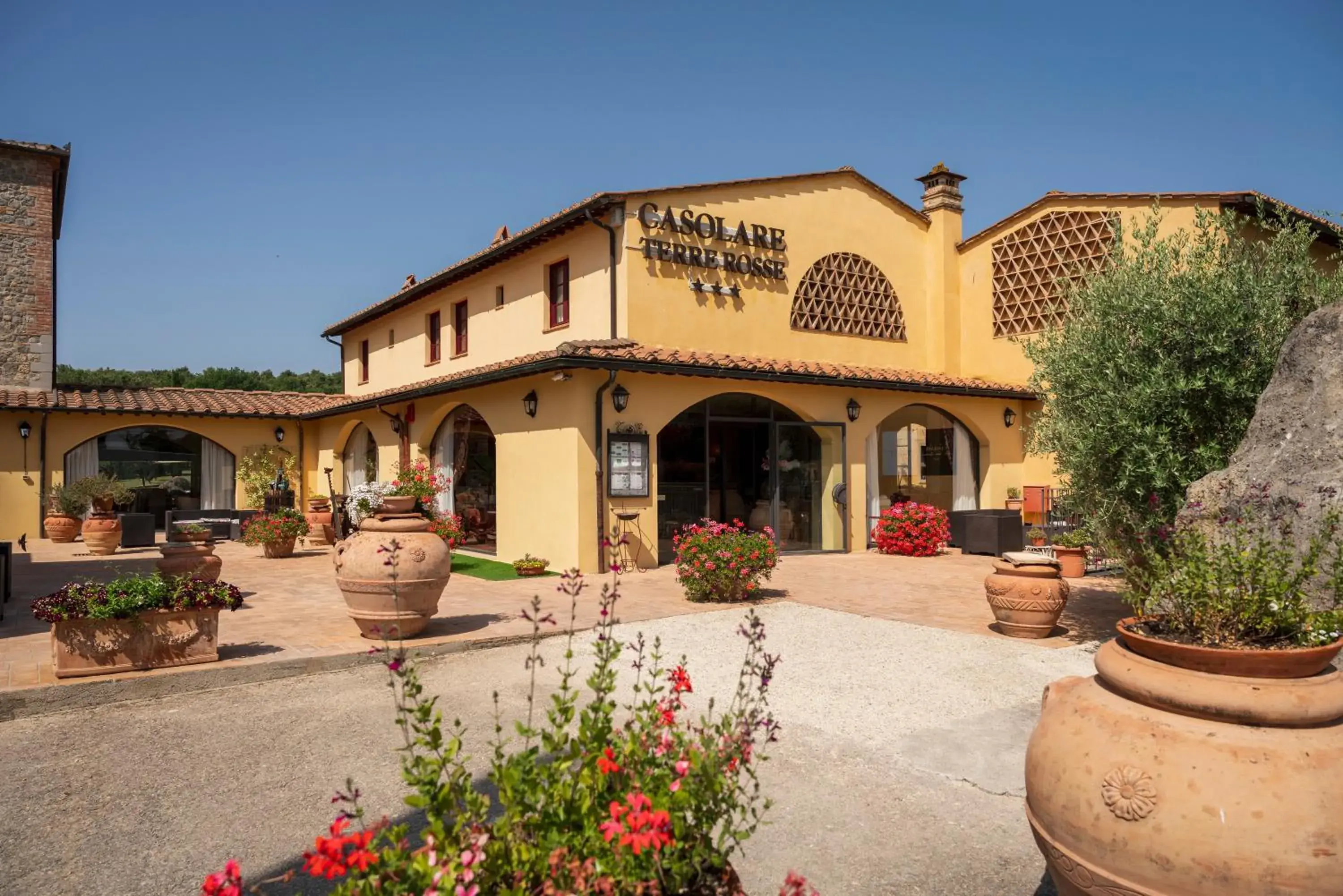 Property building in Hotel & Restaurant Casolare Le Terre Rosse Property building in Hotel & Restaurant Casolare Le Terre Rosse