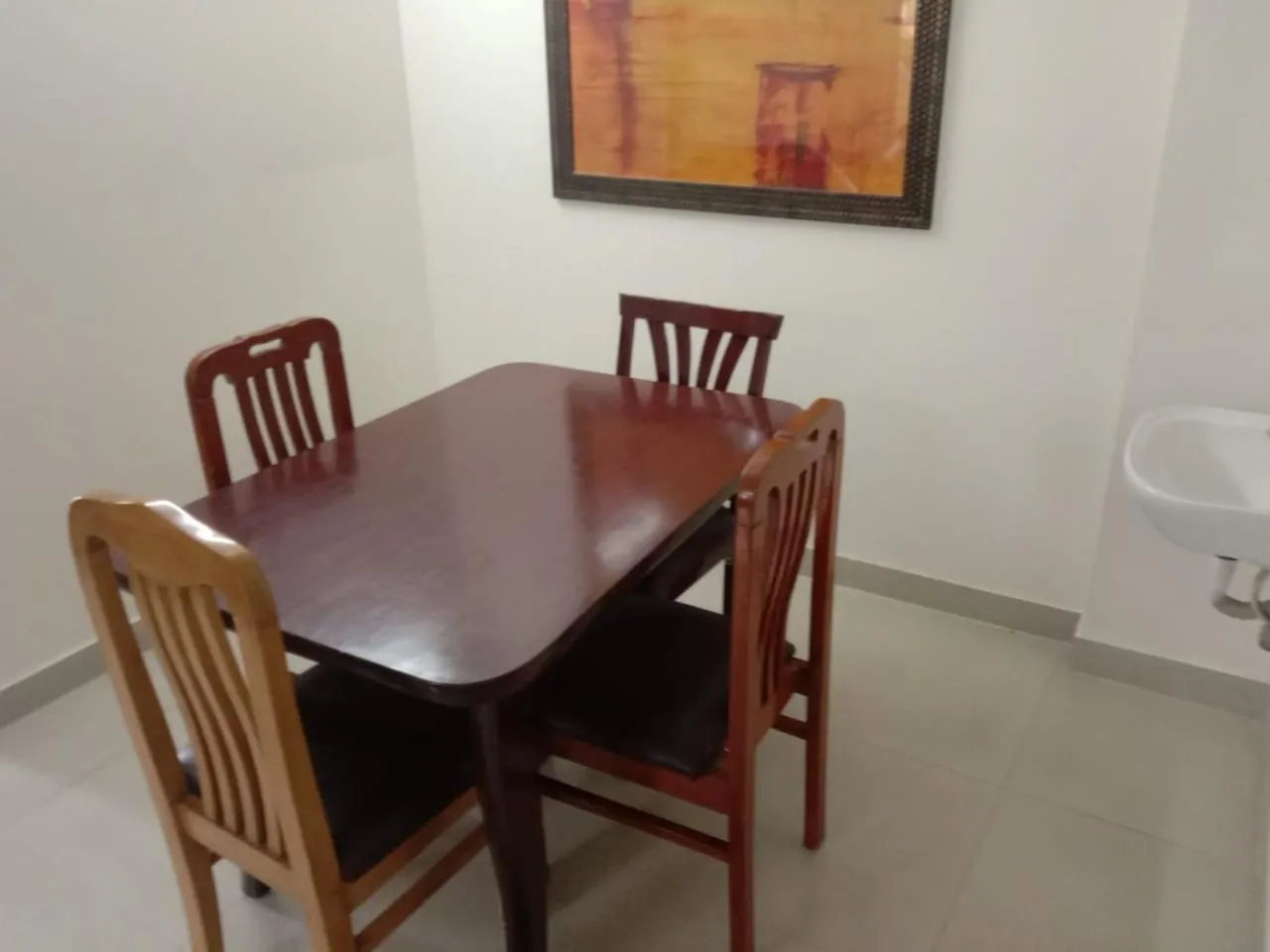Dining area in The Altruist Business Stays B-2