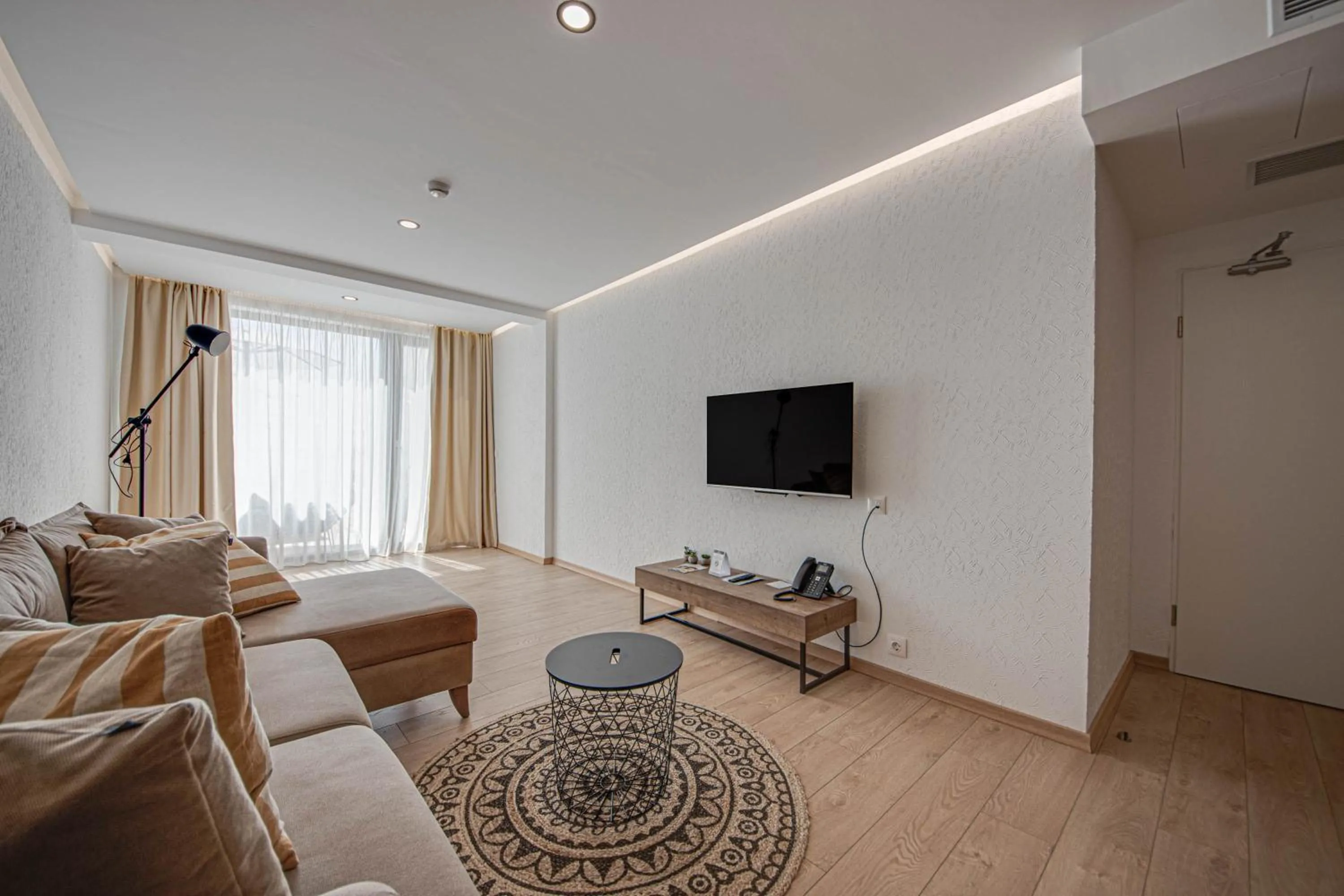 Communal lounge/ TV room in Olive Villas Beach Hotel