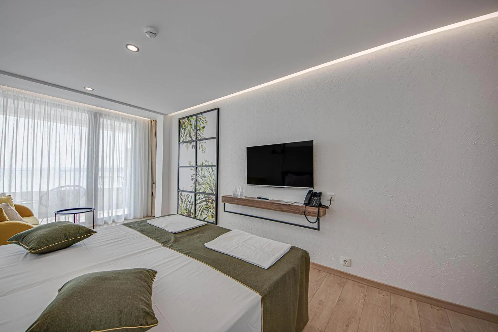 Communal lounge/ TV room, Bed in Olive Villas Beach Hotel