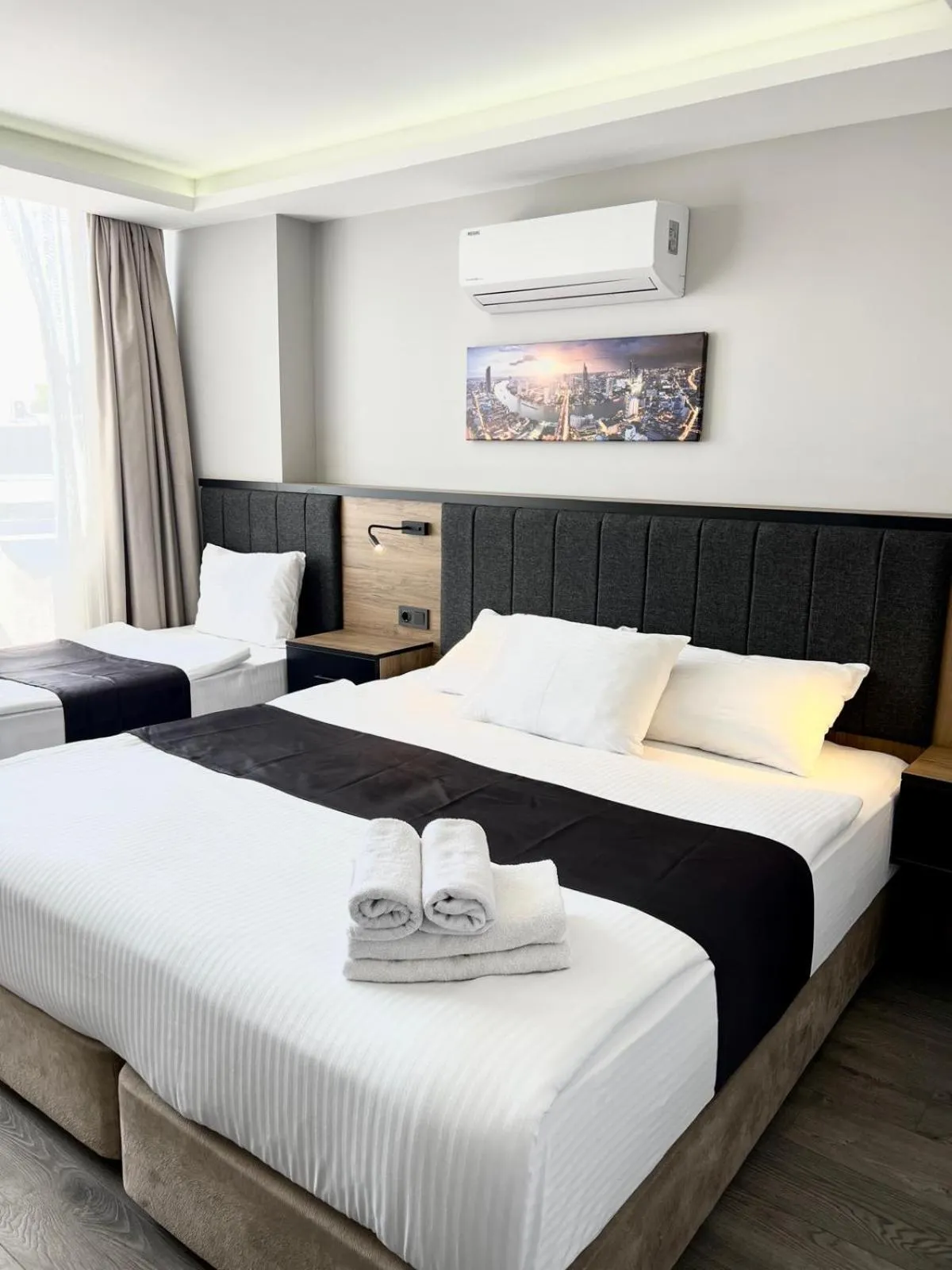 Bed in Comfort Center Suit Hotel