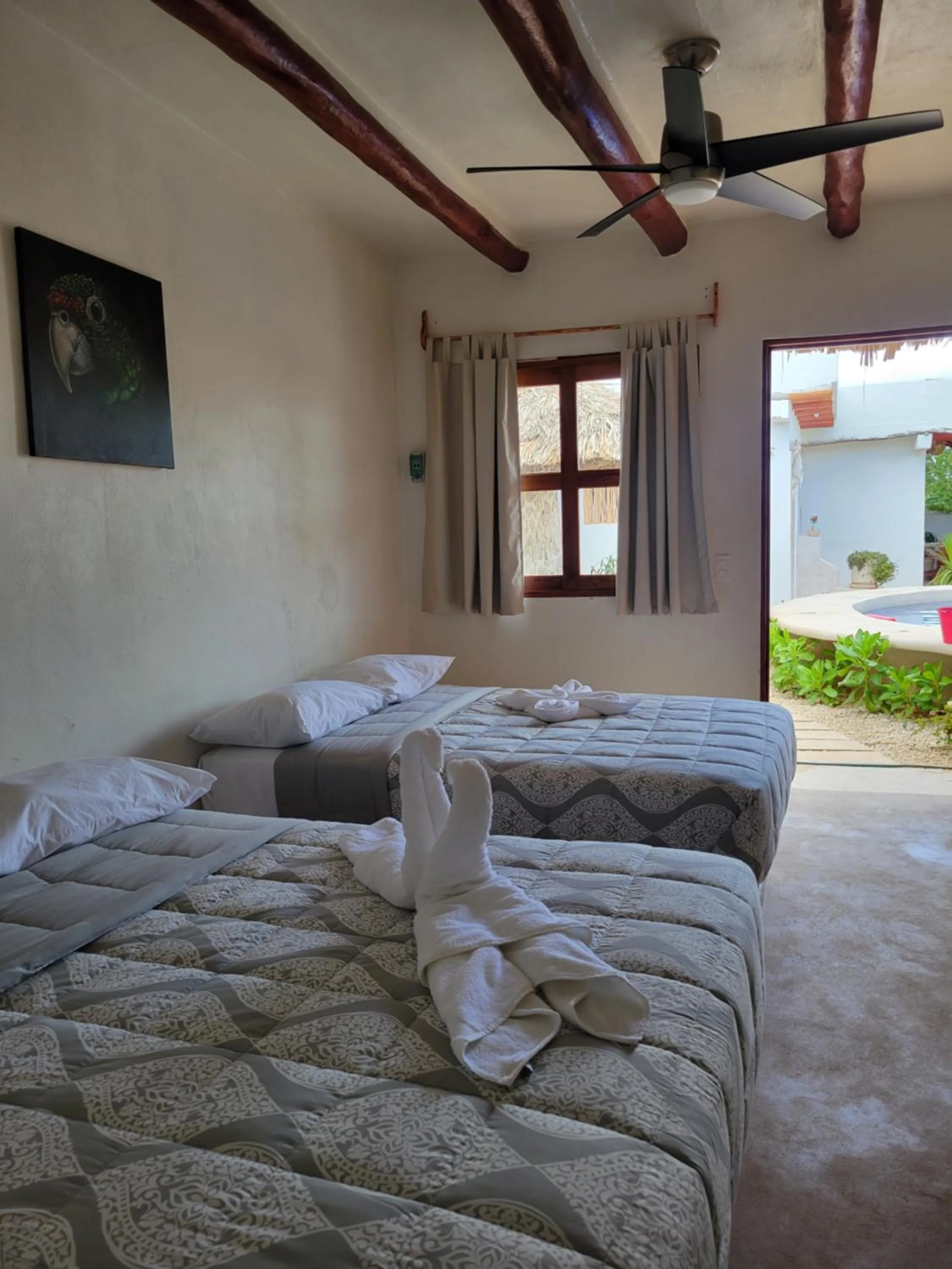 Pool view, Bed in Villas Ixchel