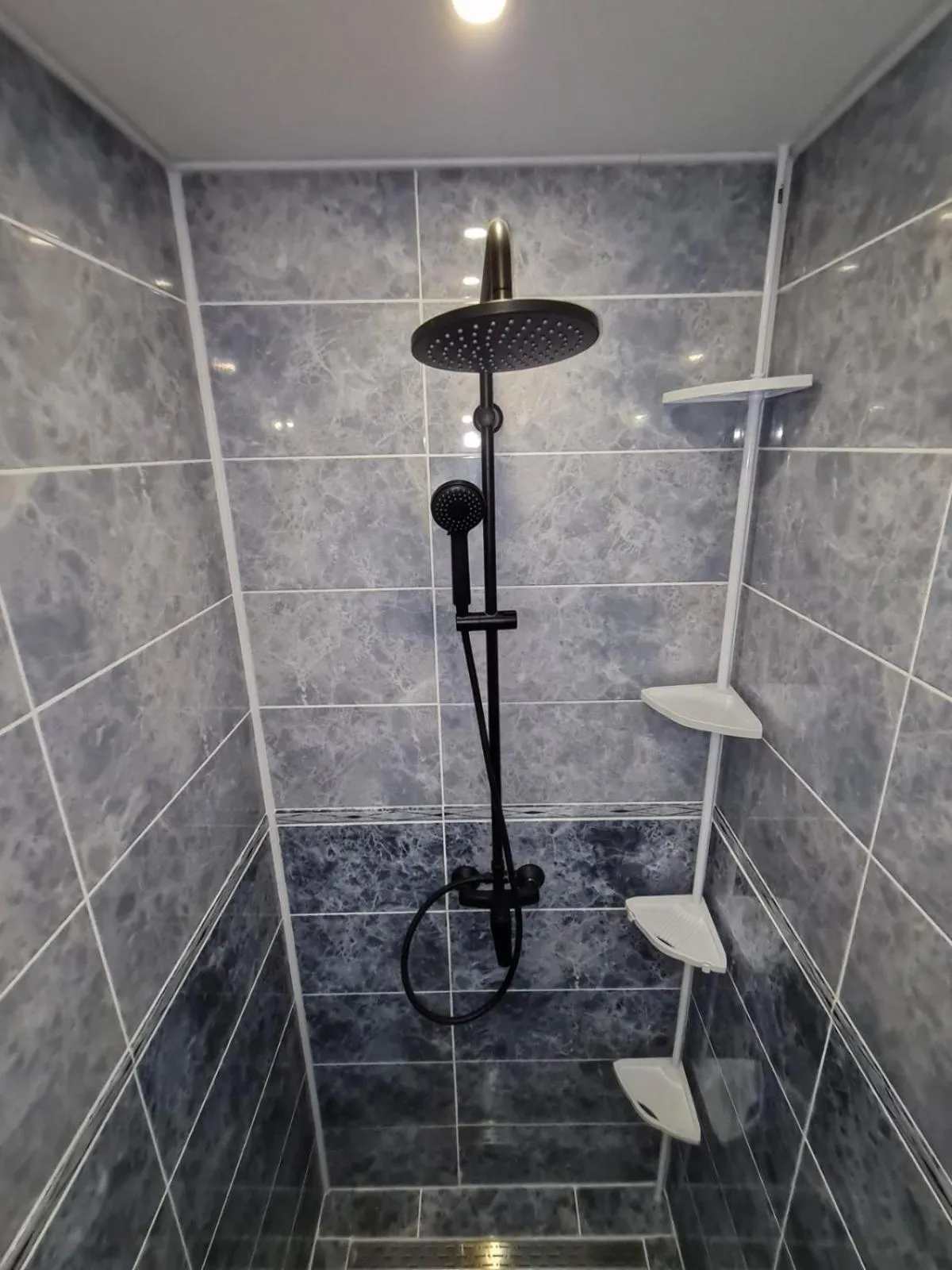 Shower in apartman Goga with pool and jacuzzi