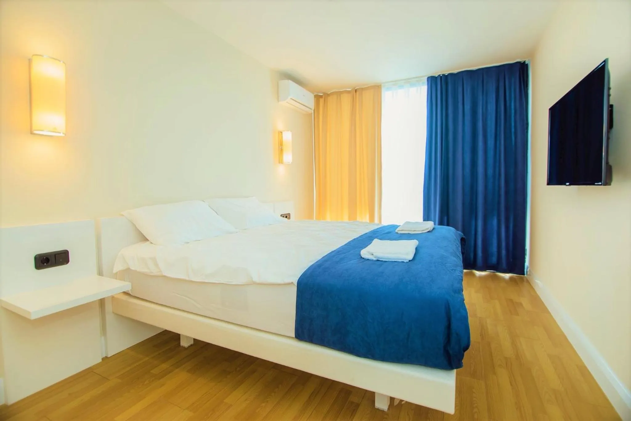 Communal lounge/ TV room in Orbi City Hotel With Sea View