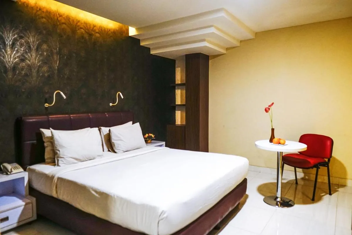 Bed in Empress Hotel Makassar City Center by LIFE