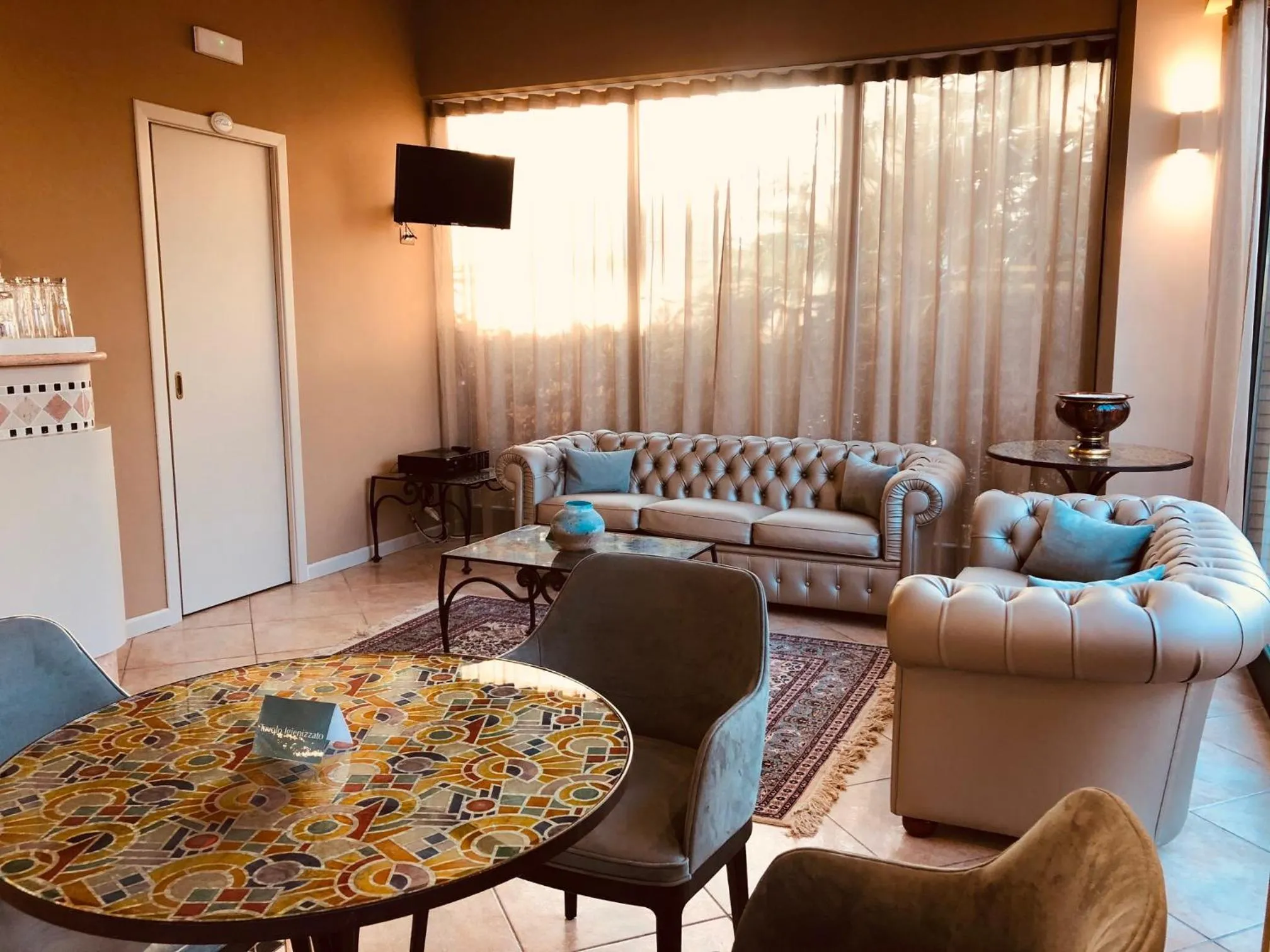 Communal lounge/ TV room in Hotel Duca Della Corgna