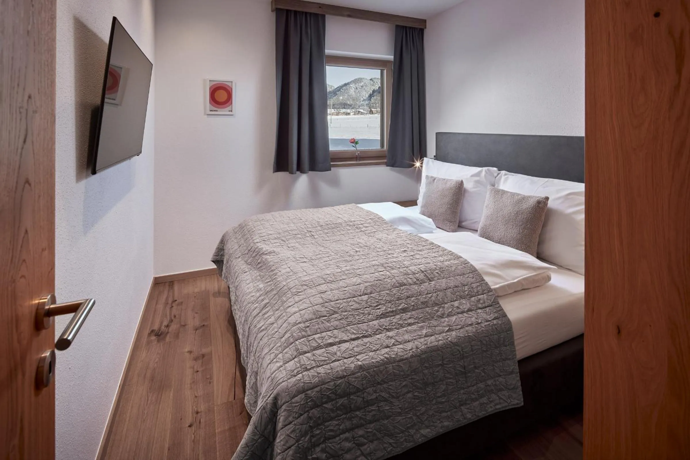 Bed in Alpin Residenzen Buchensteinwand St. Ulrich by Alpina-Holiday