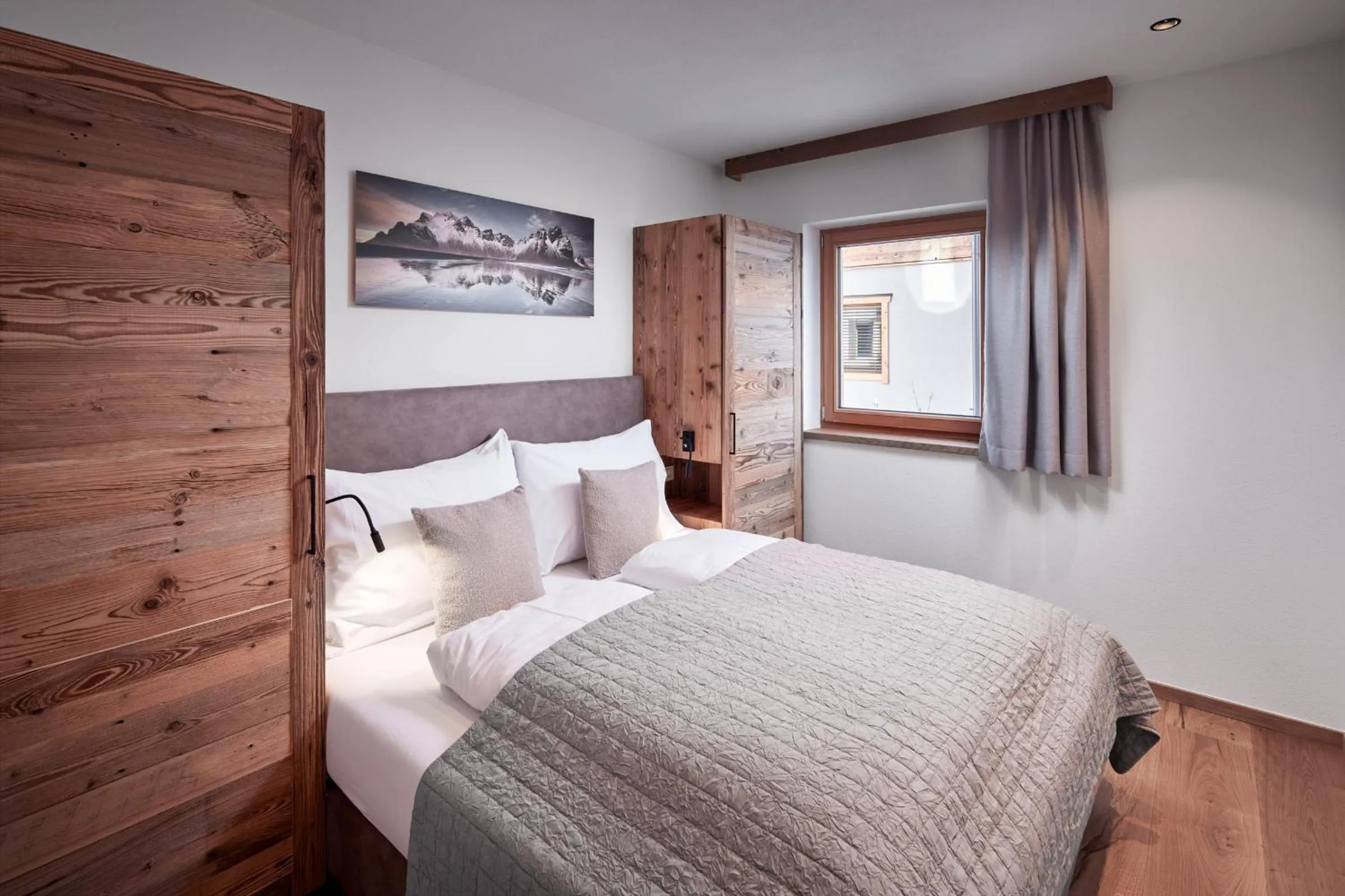 Bed in Alpin Residenzen Buchensteinwand St. Ulrich by Alpina-Holiday