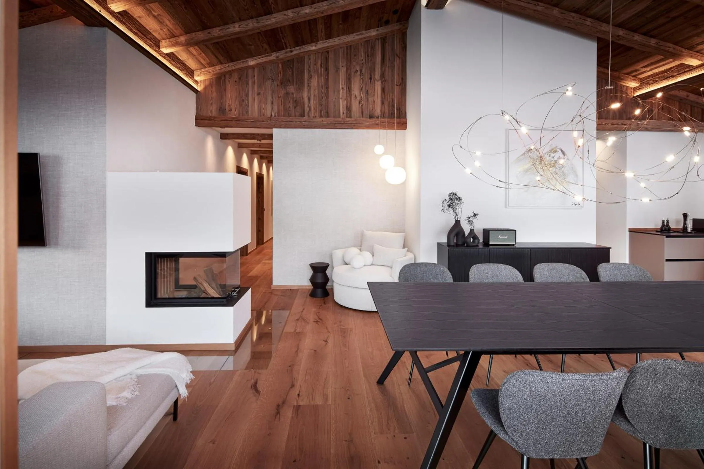 Living room in Alpin Residenzen Buchensteinwand St. Ulrich by Alpina-Holiday