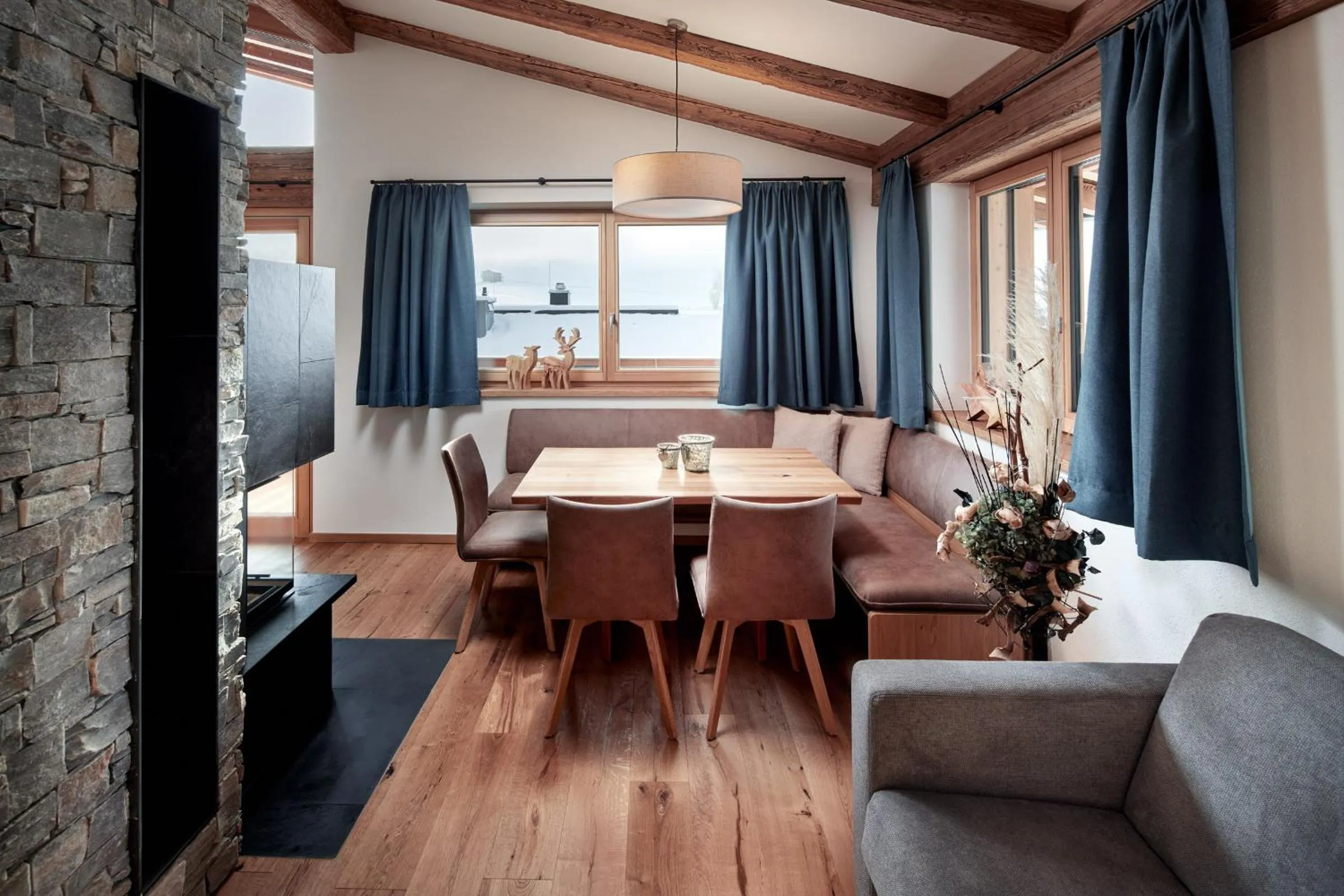 Living room in Alpin Residenzen Buchensteinwand St. Ulrich by Alpina-Holiday