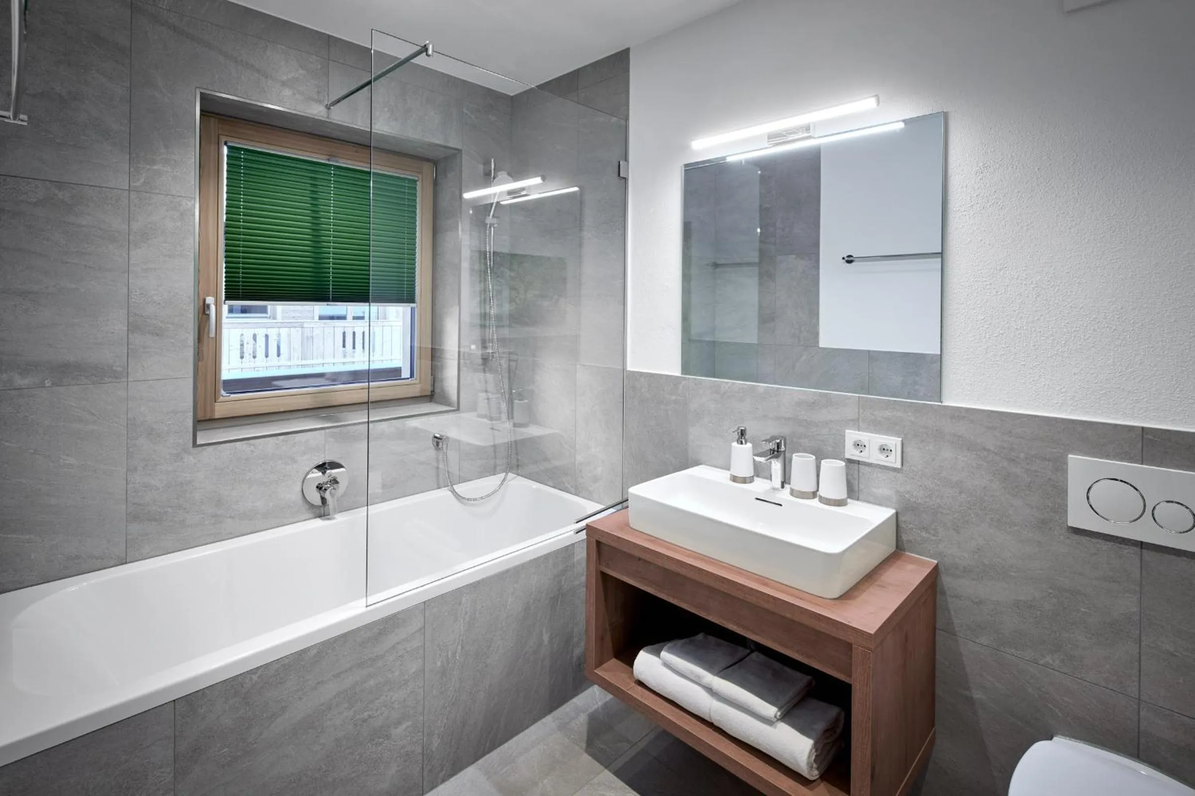 Bathroom in Alpin Residenzen Buchensteinwand St. Ulrich by Alpina-Holiday