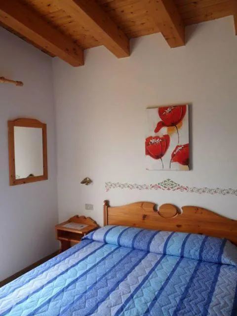 Bed in Hotel Garni Tosca