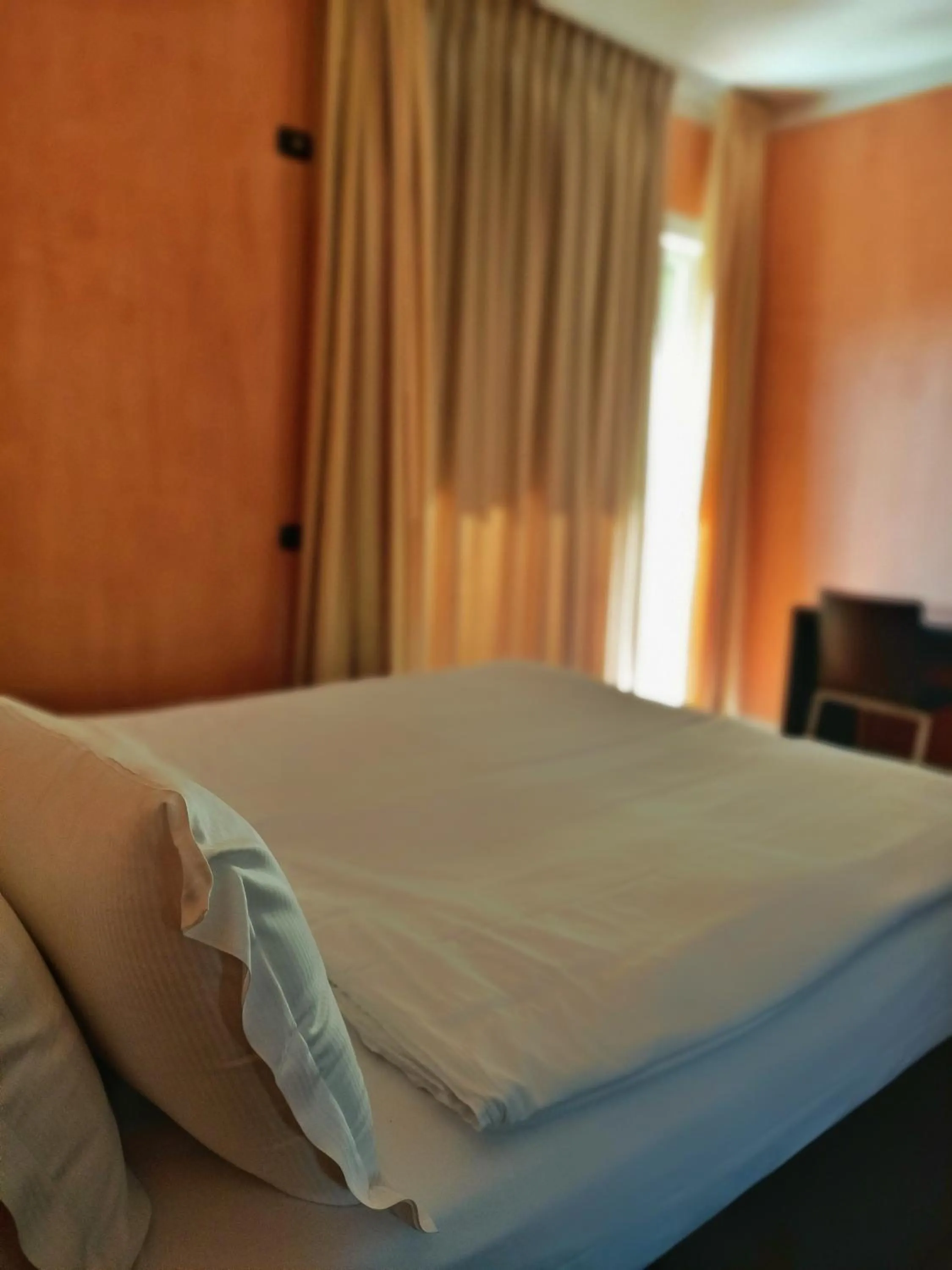 Bed in Aquazzurra Resort & Aparthotel