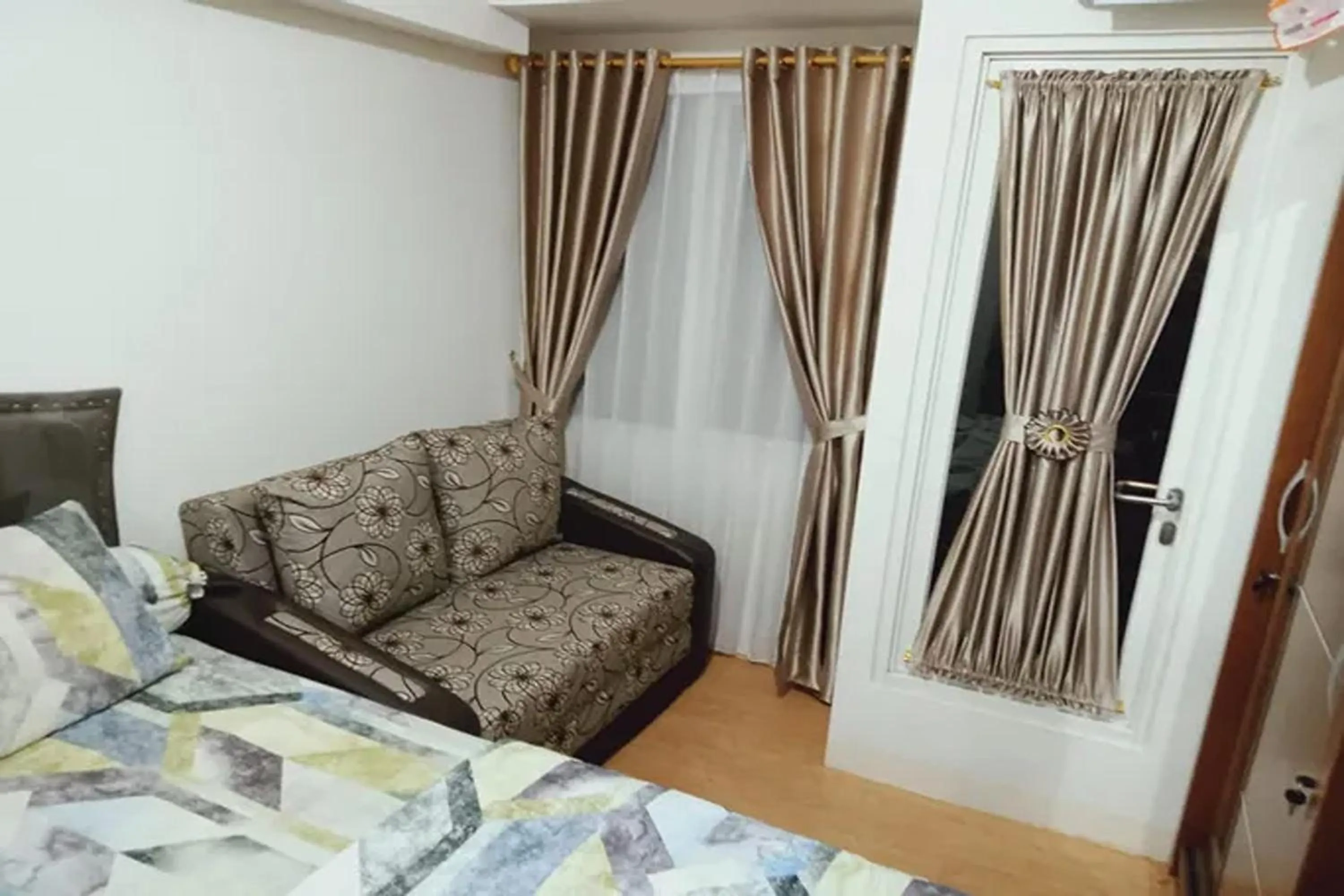 Living room, Bed in Velito at Podomoro Golf View Apartment