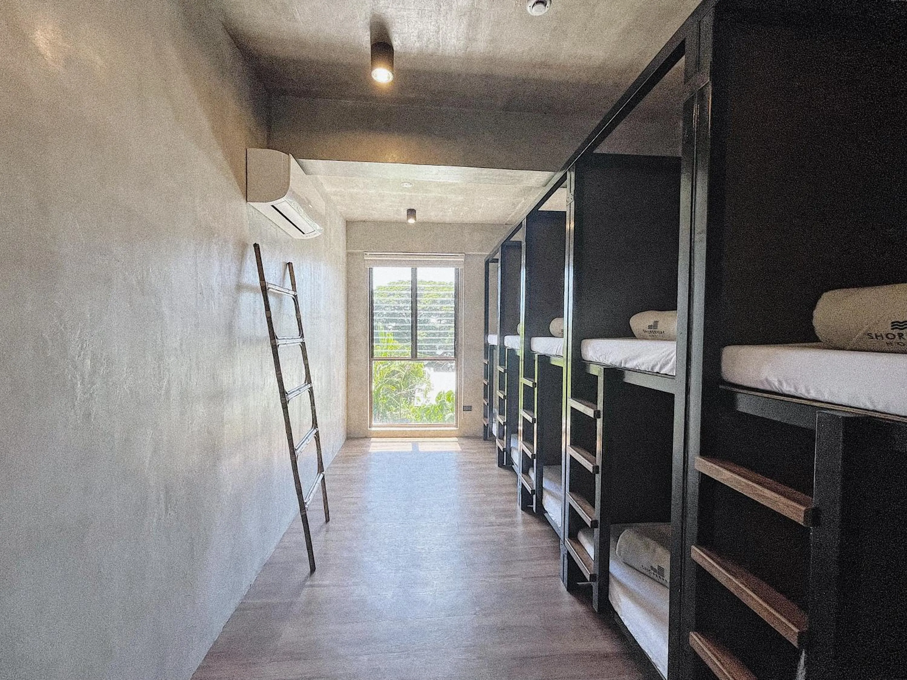 Photo of the whole room in Shorebreak Hostel San Juan La Union