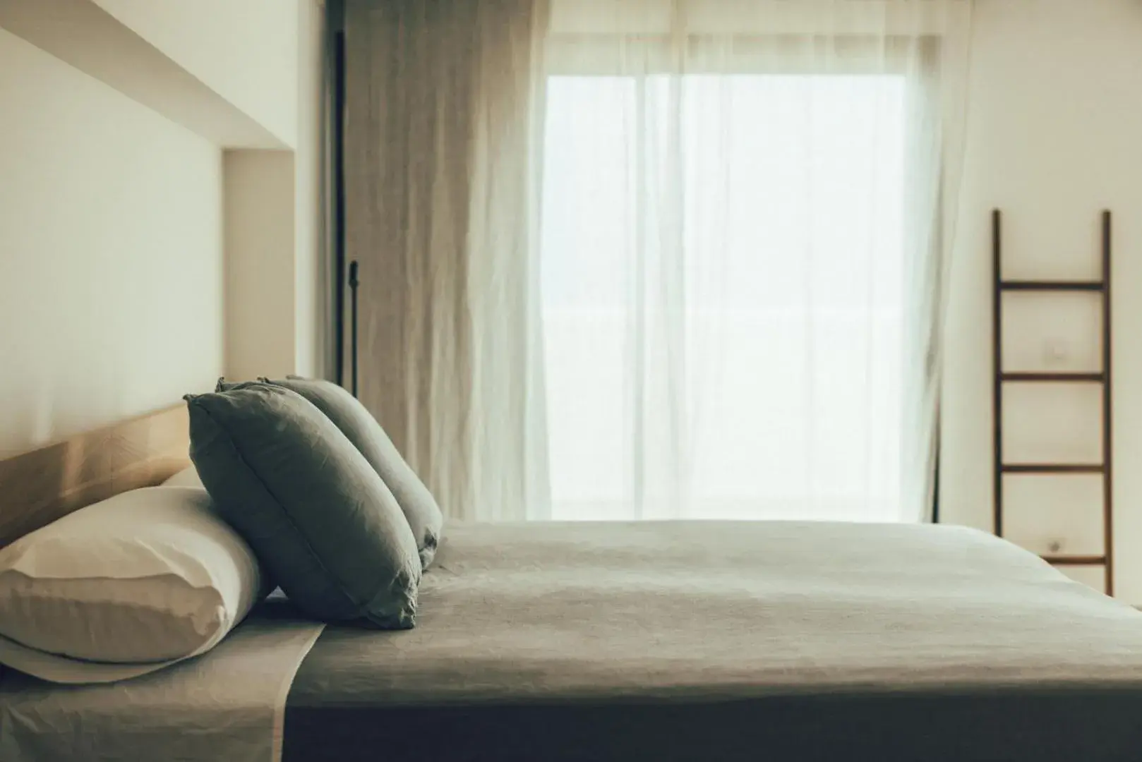 Bed in Cala Lanuza Suites Bed in Cala Lanuza Suites