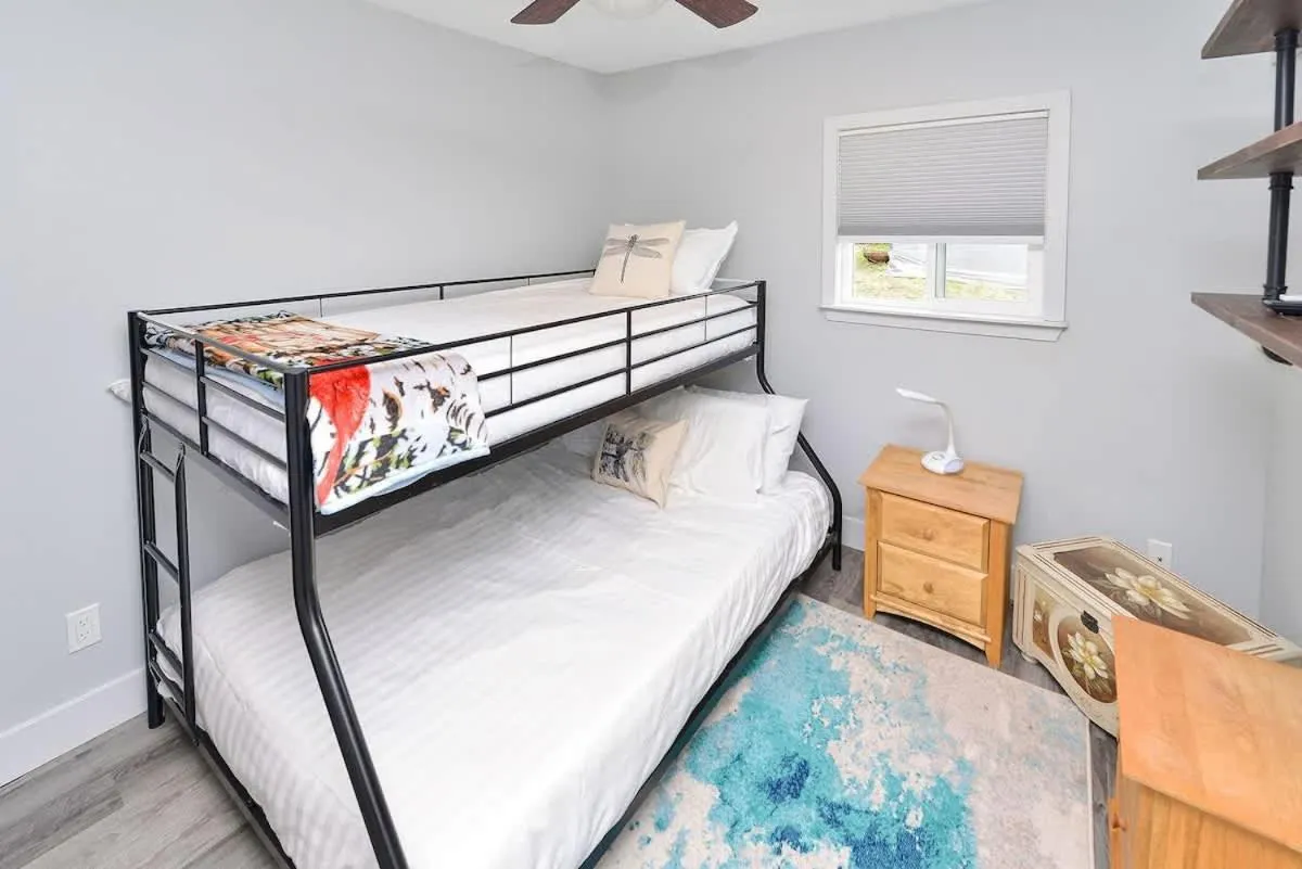 Bed in Dragonfly Cottage by EMR Vacation Rentals