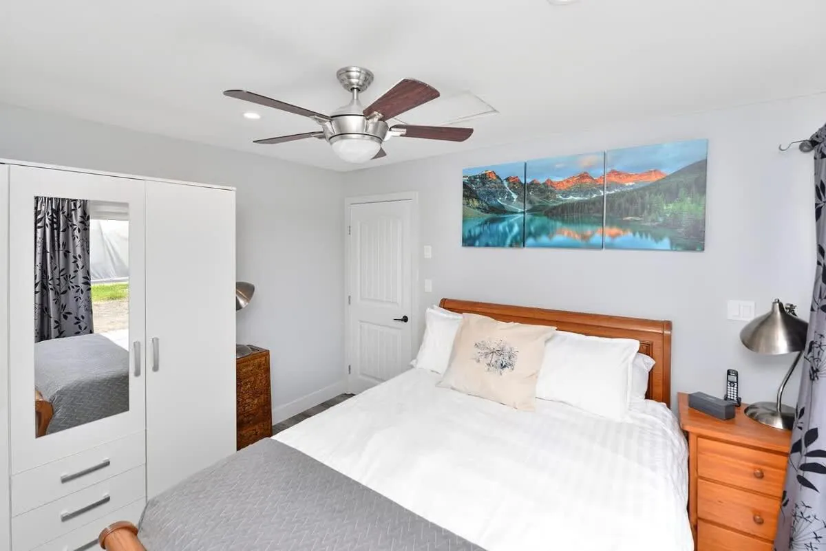 Bed in Dragonfly Cottage by EMR Vacation Rentals