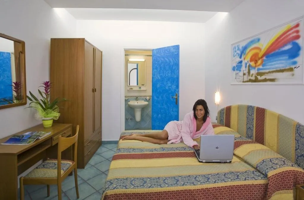 Photo of the whole room in Albergo Villa Hibiscus