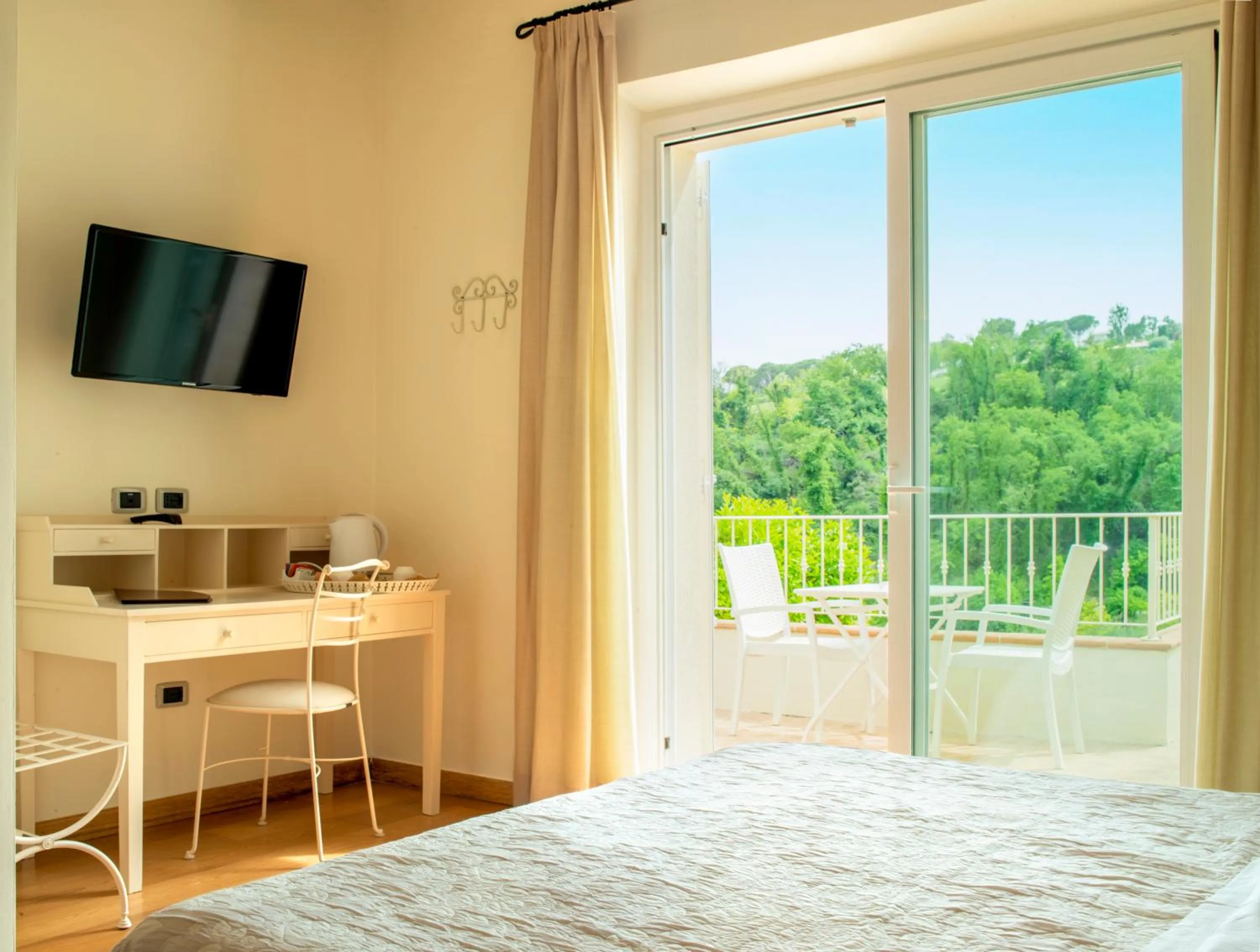 Bed in Hotel Giardino Suites&Spa