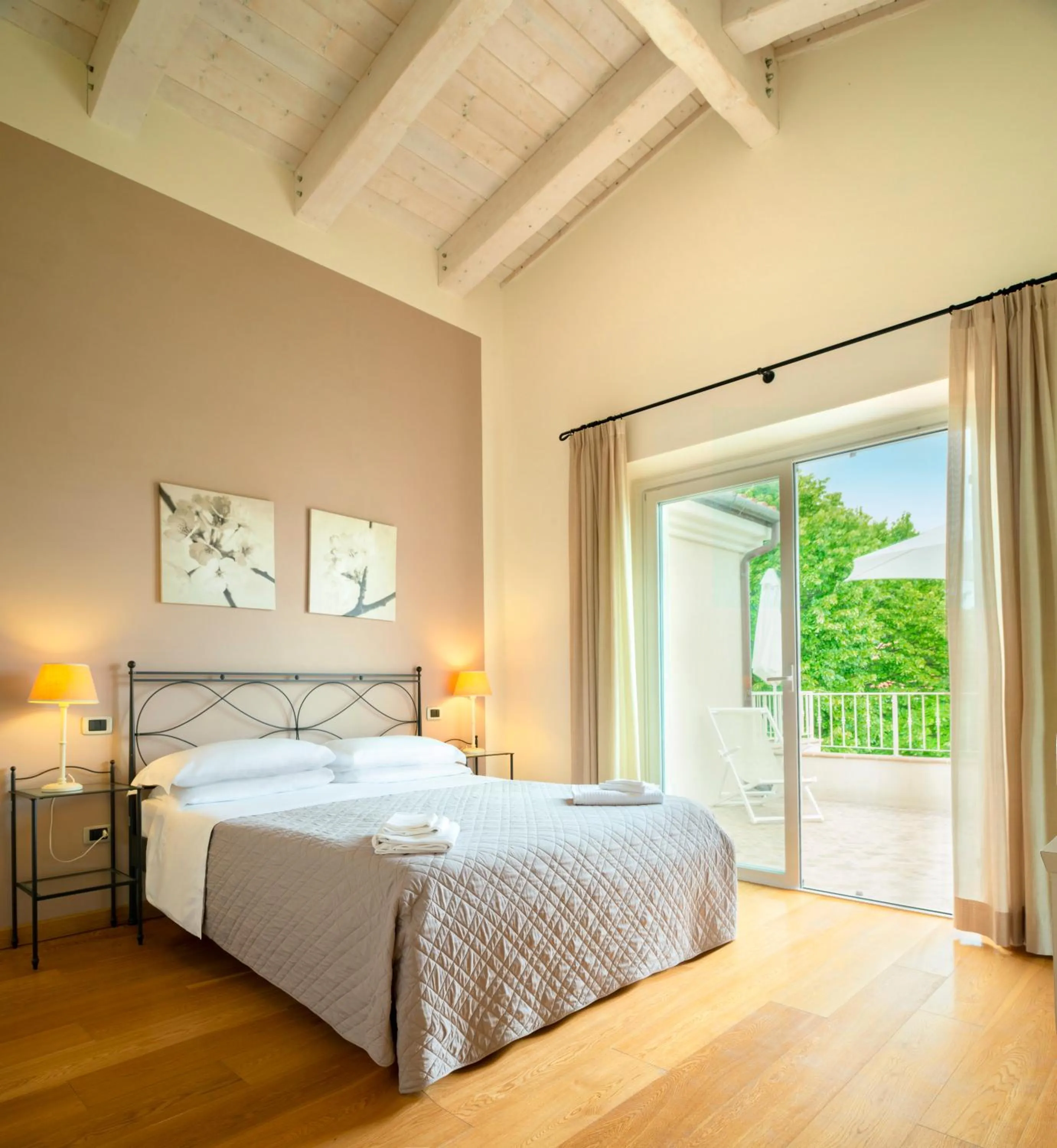 Bed in Hotel Giardino Suites&Spa