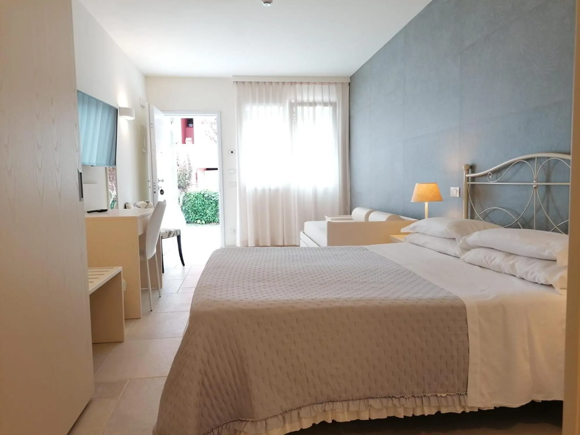 Bed in Hotel Giardino Suites&Spa