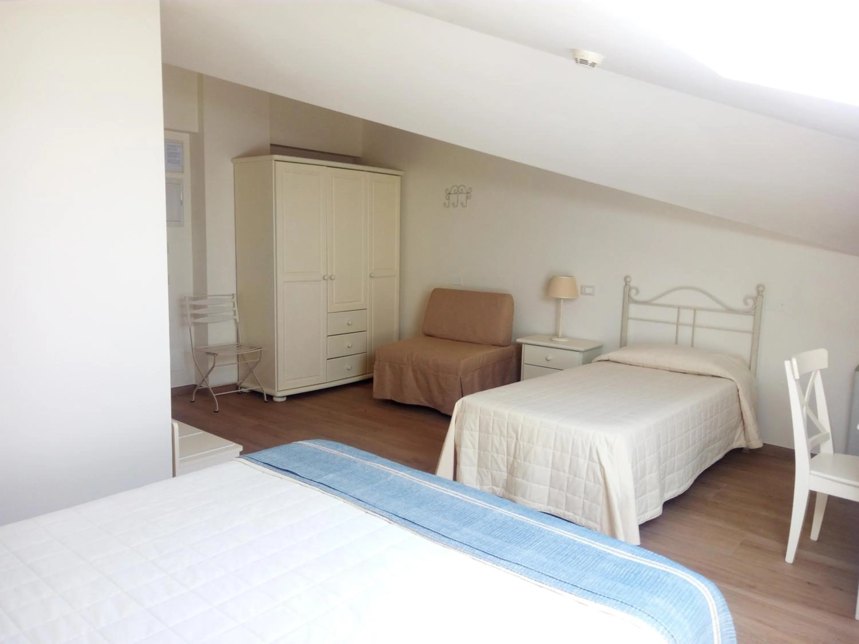 Bed in Hotel Giardino Suites&Spa