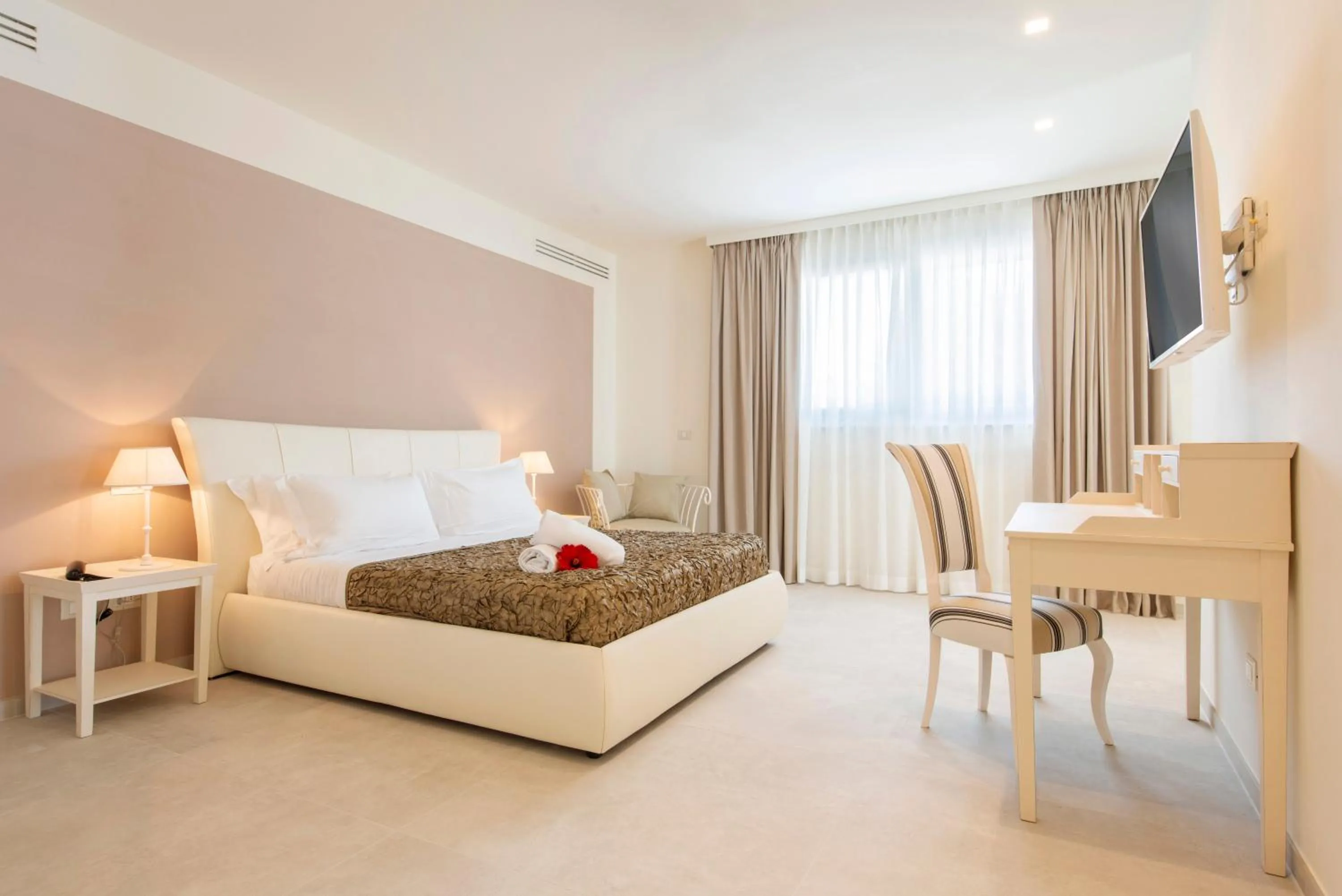 Bed in Hotel Giardino Suites&Spa
