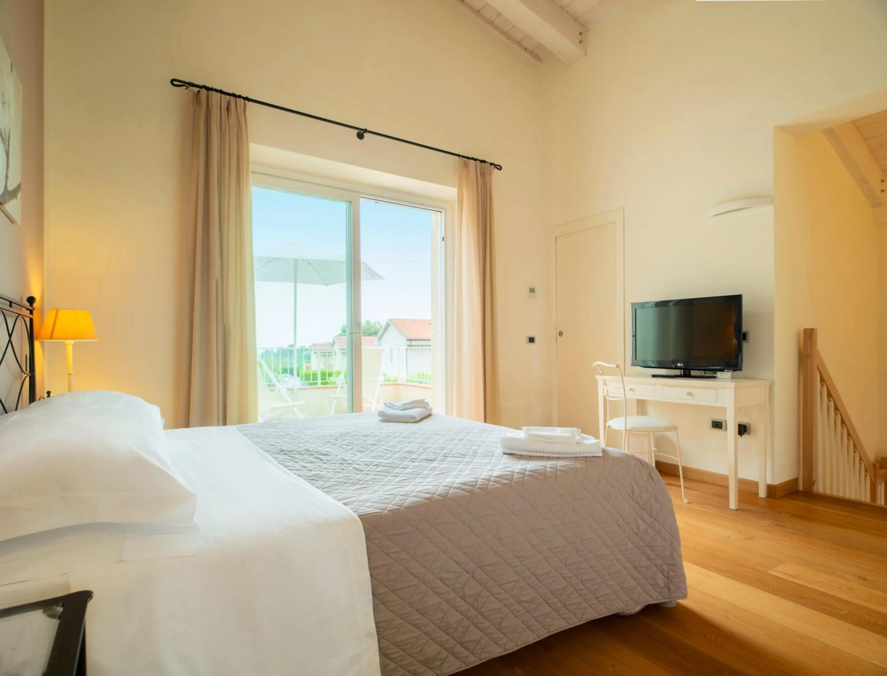 Bed in Hotel Giardino Suites&Spa