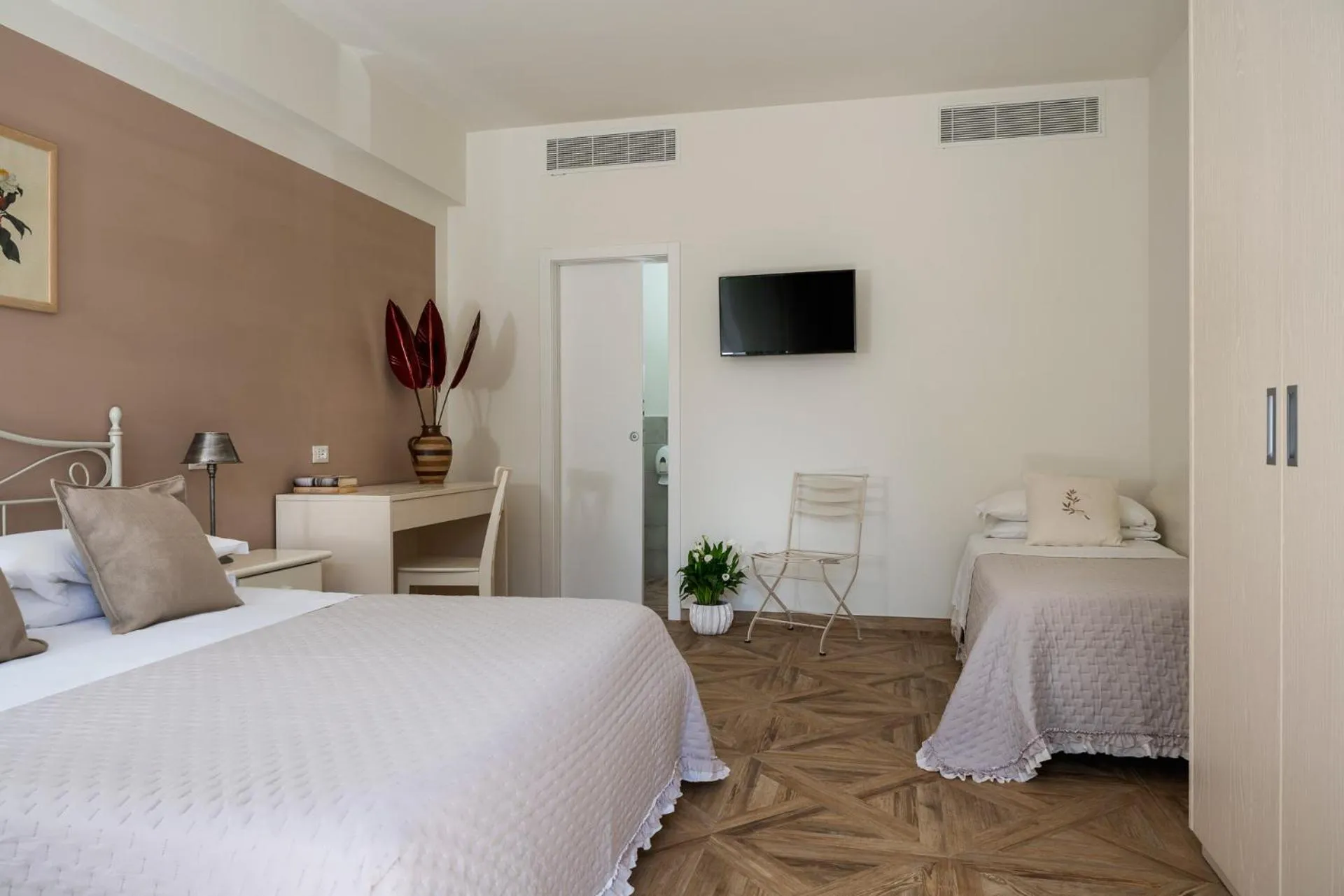 Bed in Hotel Giardino Suites&Spa