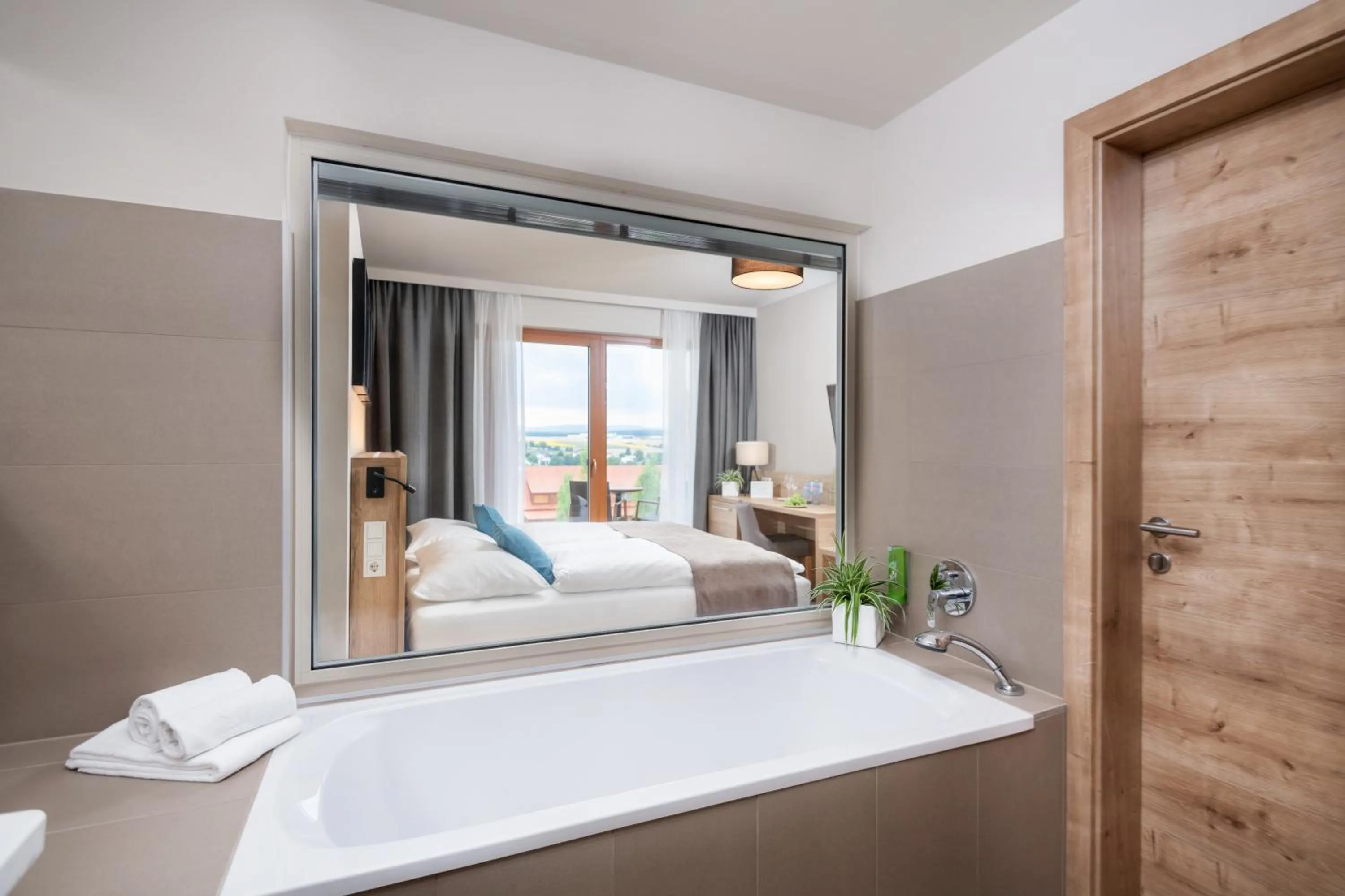 Bathroom, Bed in JUFA Hotel Neutal