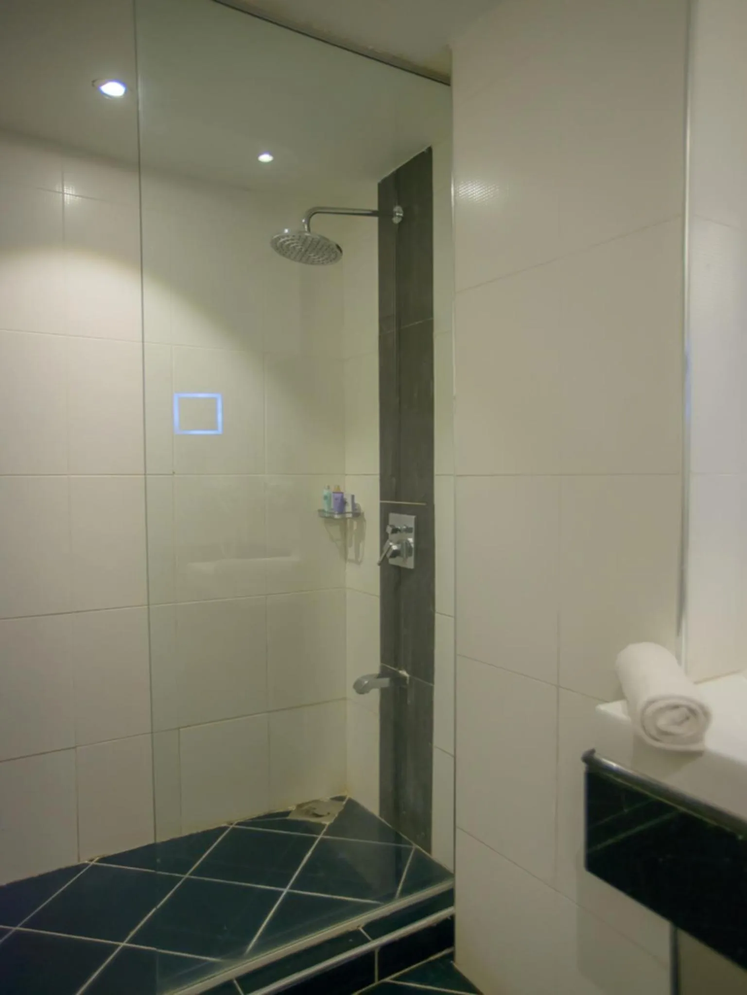 Shower in Cloud Hotel & Suites
