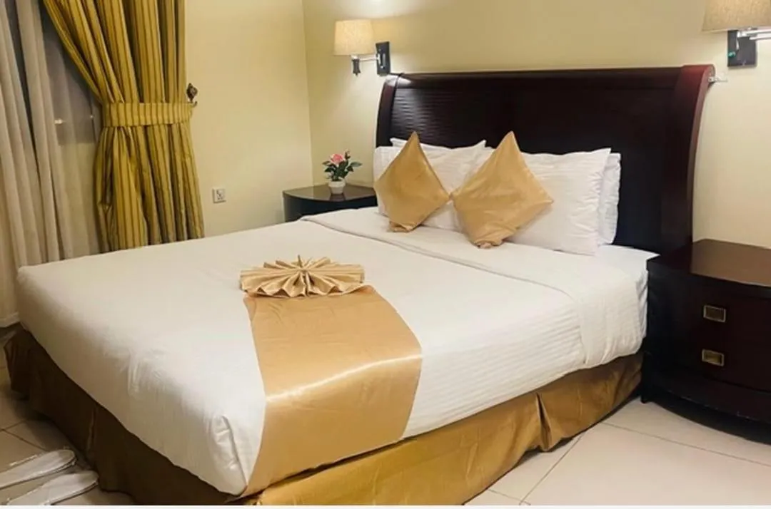 Bed in Crown Palace Hotel