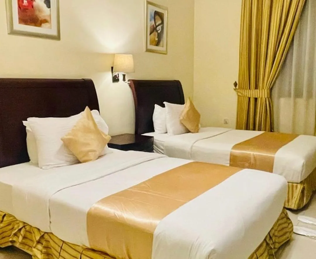 Bed in Crown Palace Hotel