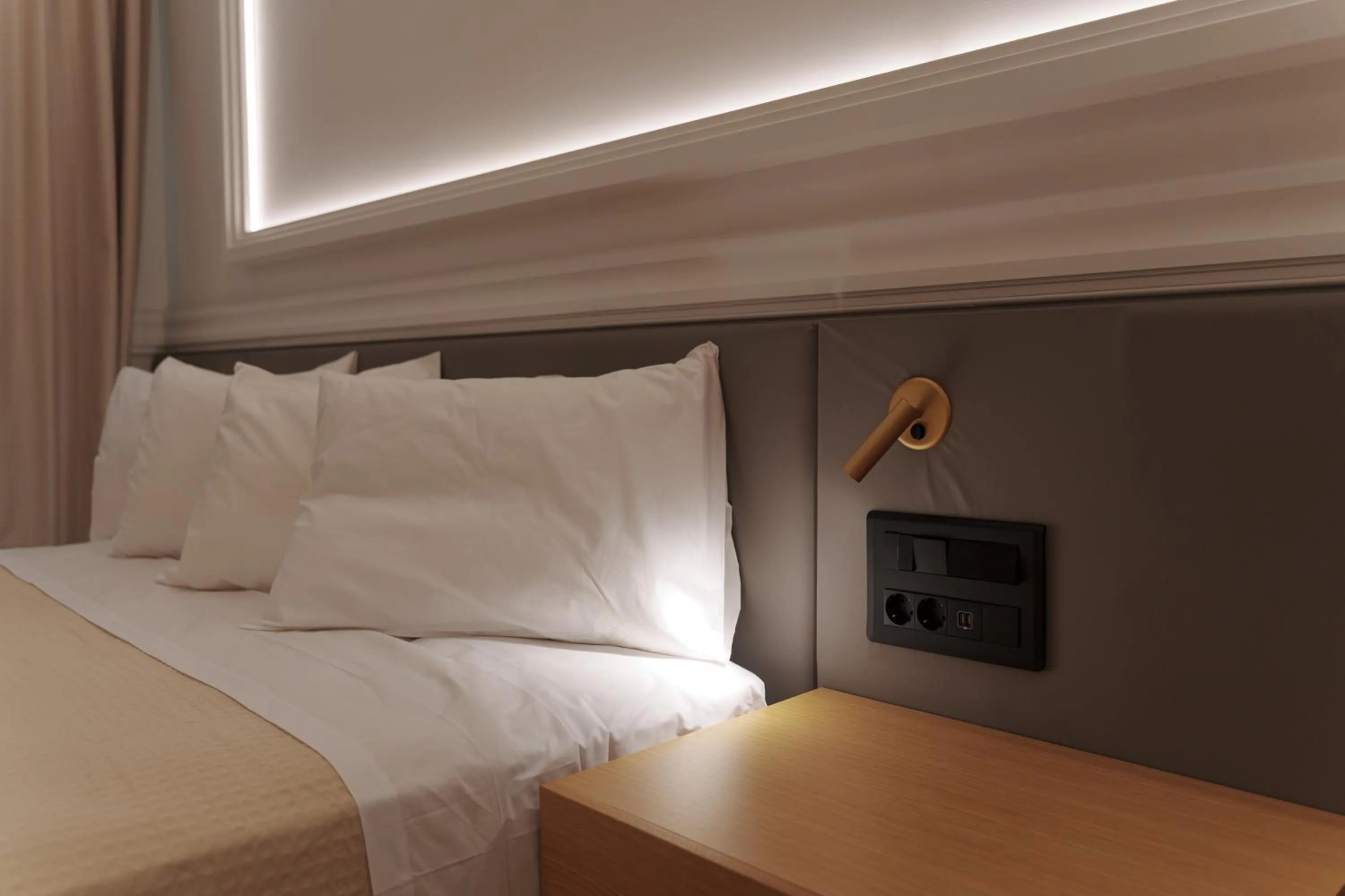 Bed in Agora Athens Suites