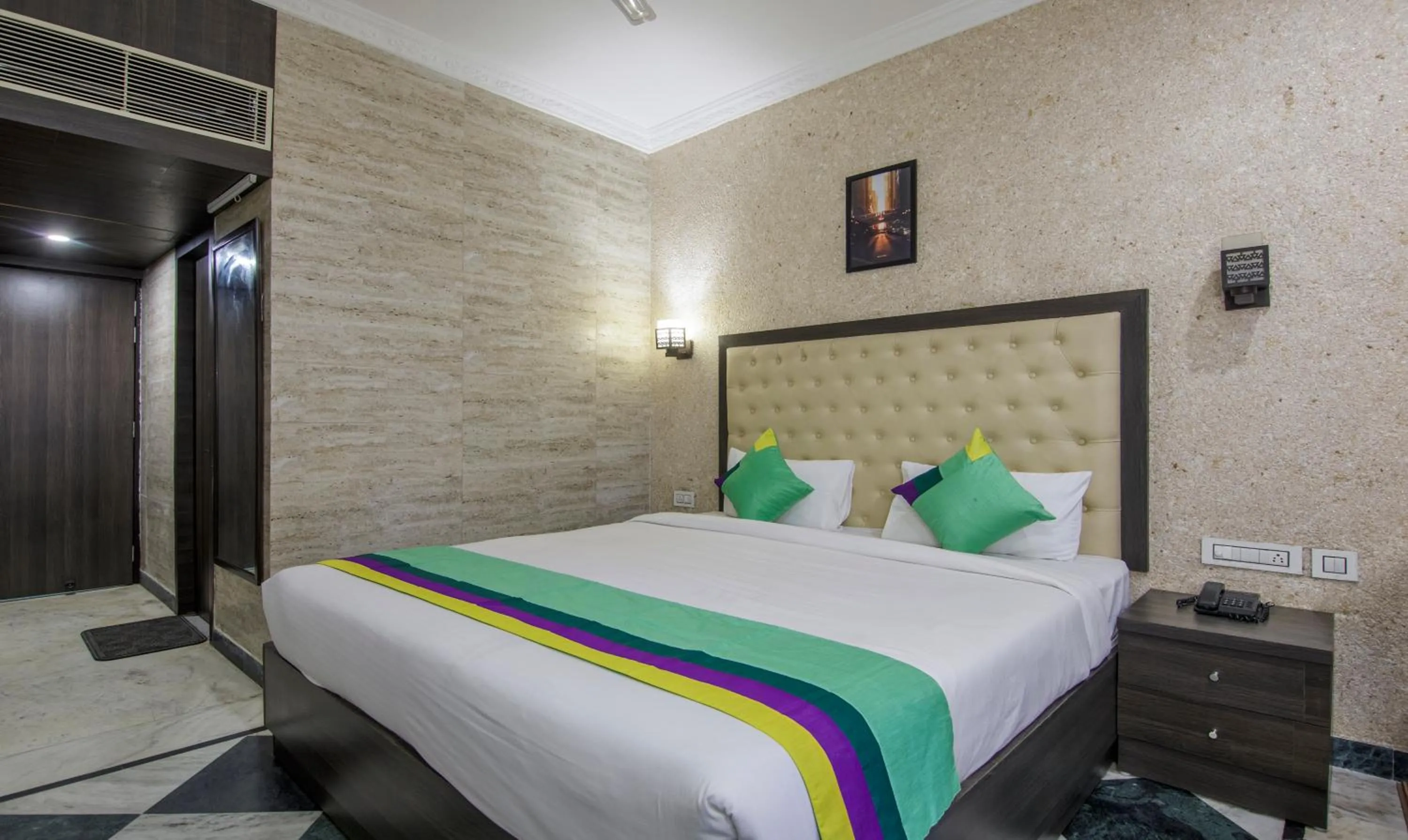 Bed in Treebo Trinetar International