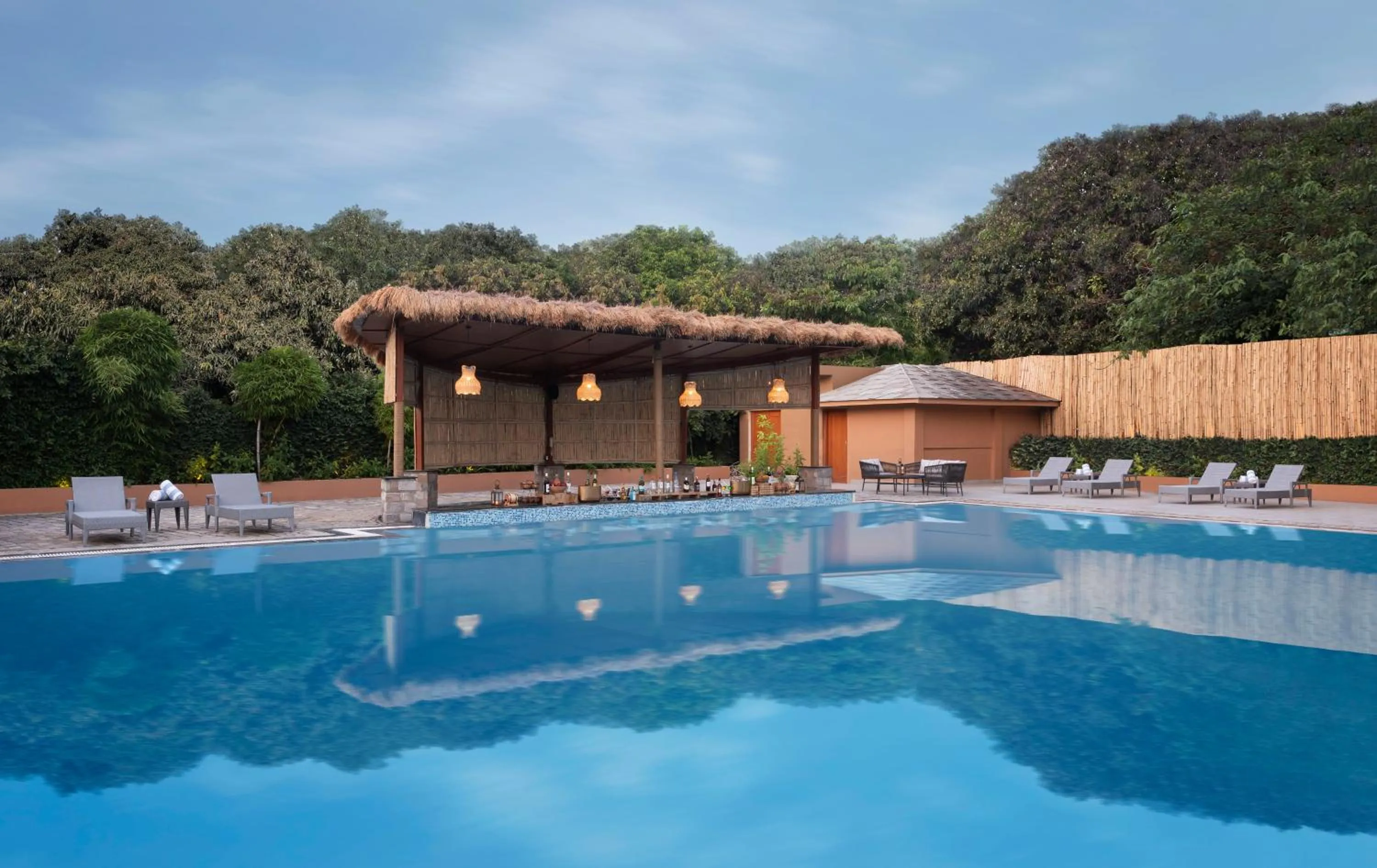 Swimming pool in voco Jim Corbett by IHG