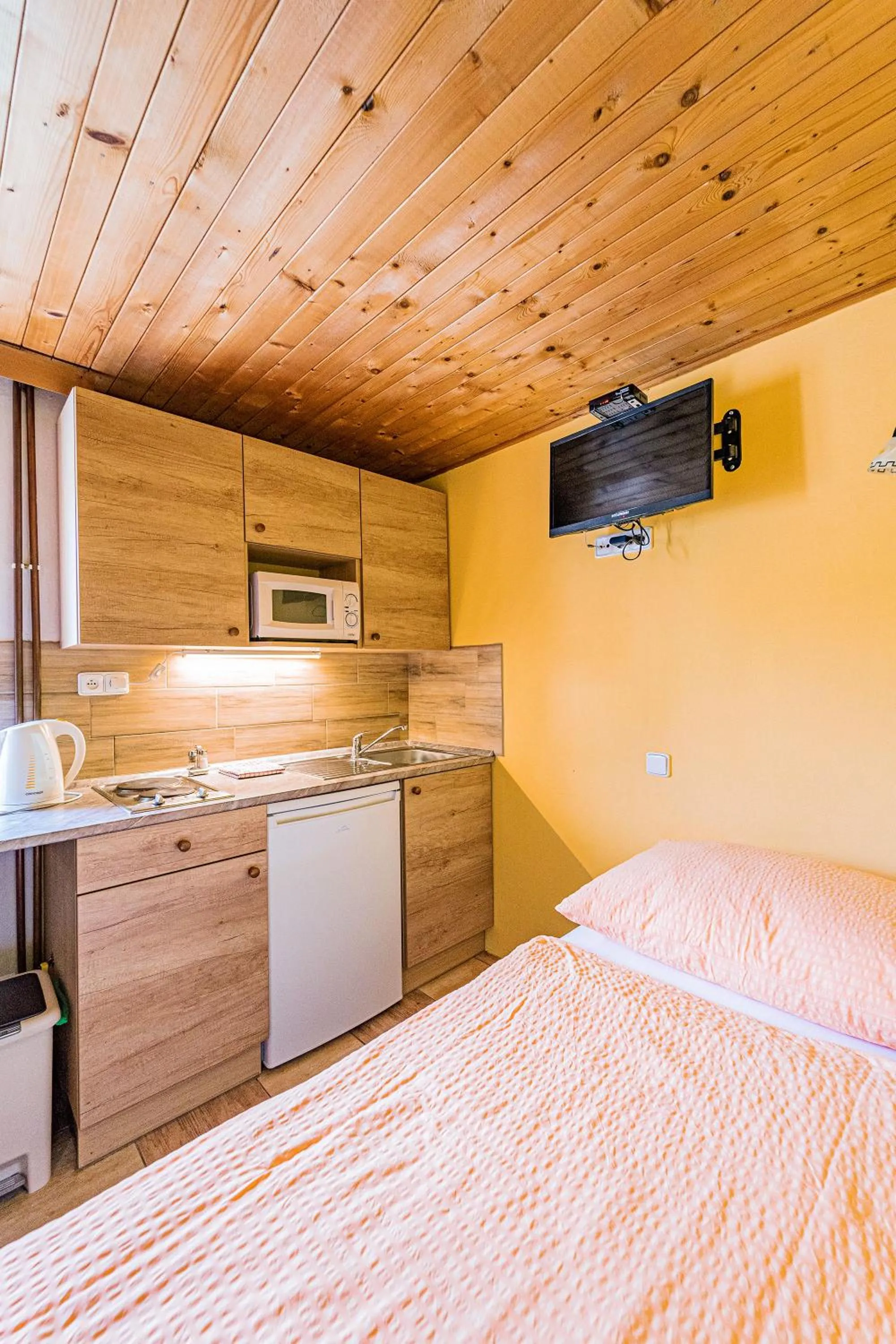 Kitchen or kitchenette, Bed in Apartmány U Žaloudků