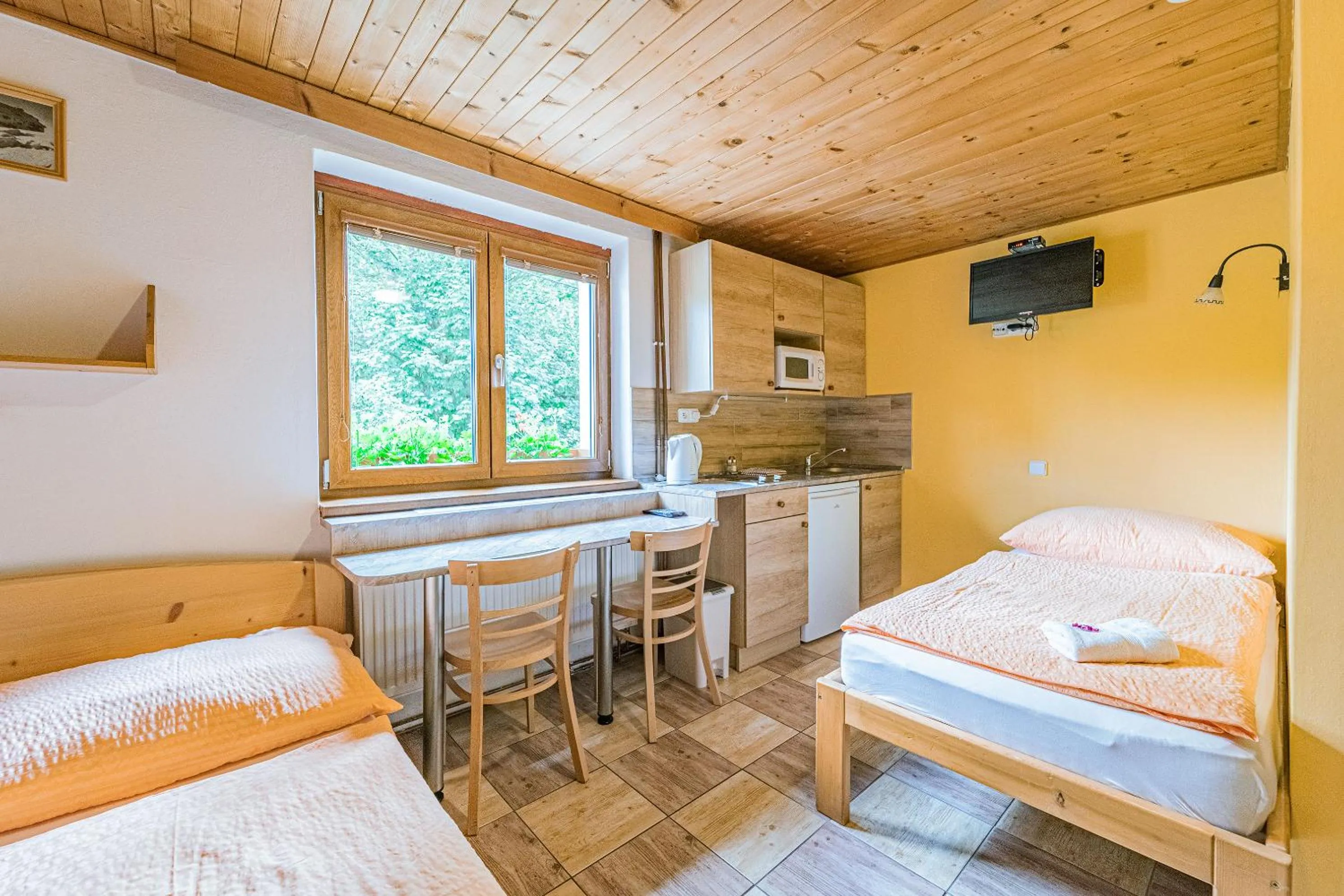 Kitchen or kitchenette, Bed in Apartmány U Žaloudků